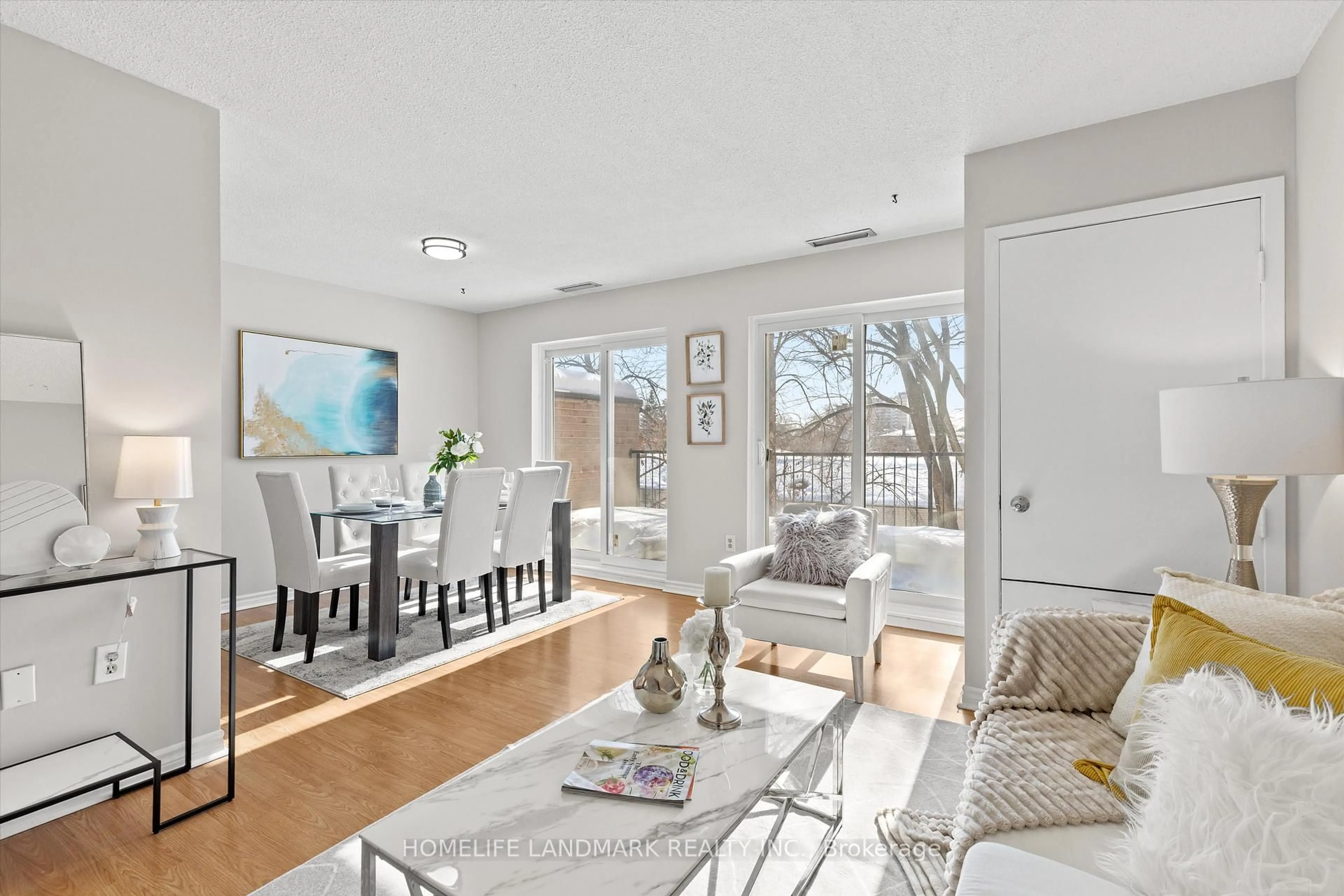 Living room with furniture, wood/laminate floor for 165 Cherokee Blvd #290, Toronto Ontario M2J 4T7