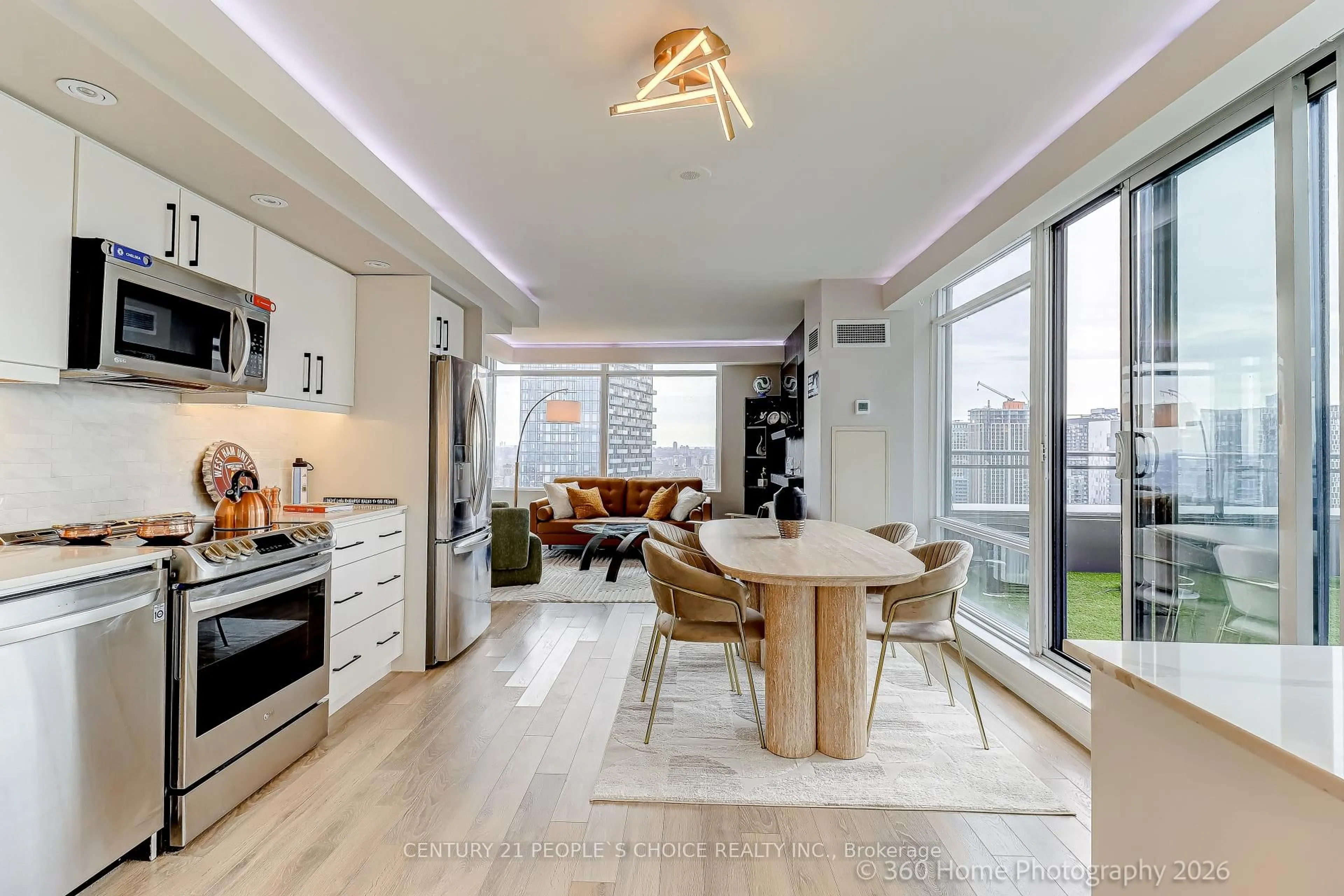 Open concept kitchen, wood/laminate floor for 25 Telegram Mews #PH5201, Toronto Ontario M5V 3Z1