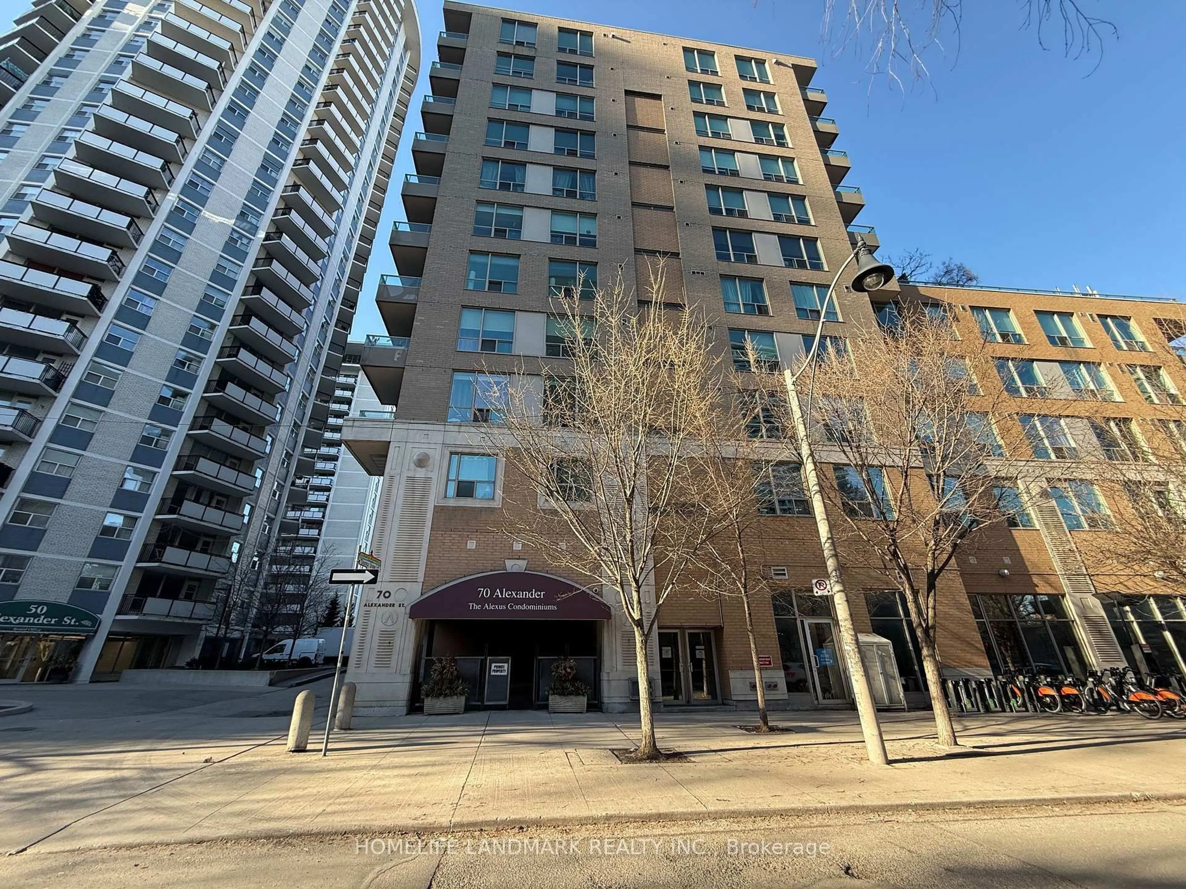A pic from outside/outdoor area/front of a property/back of a property/a pic from drone, unknown for 70 Alexander St #311, Toronto Ontario M4Y 3B6