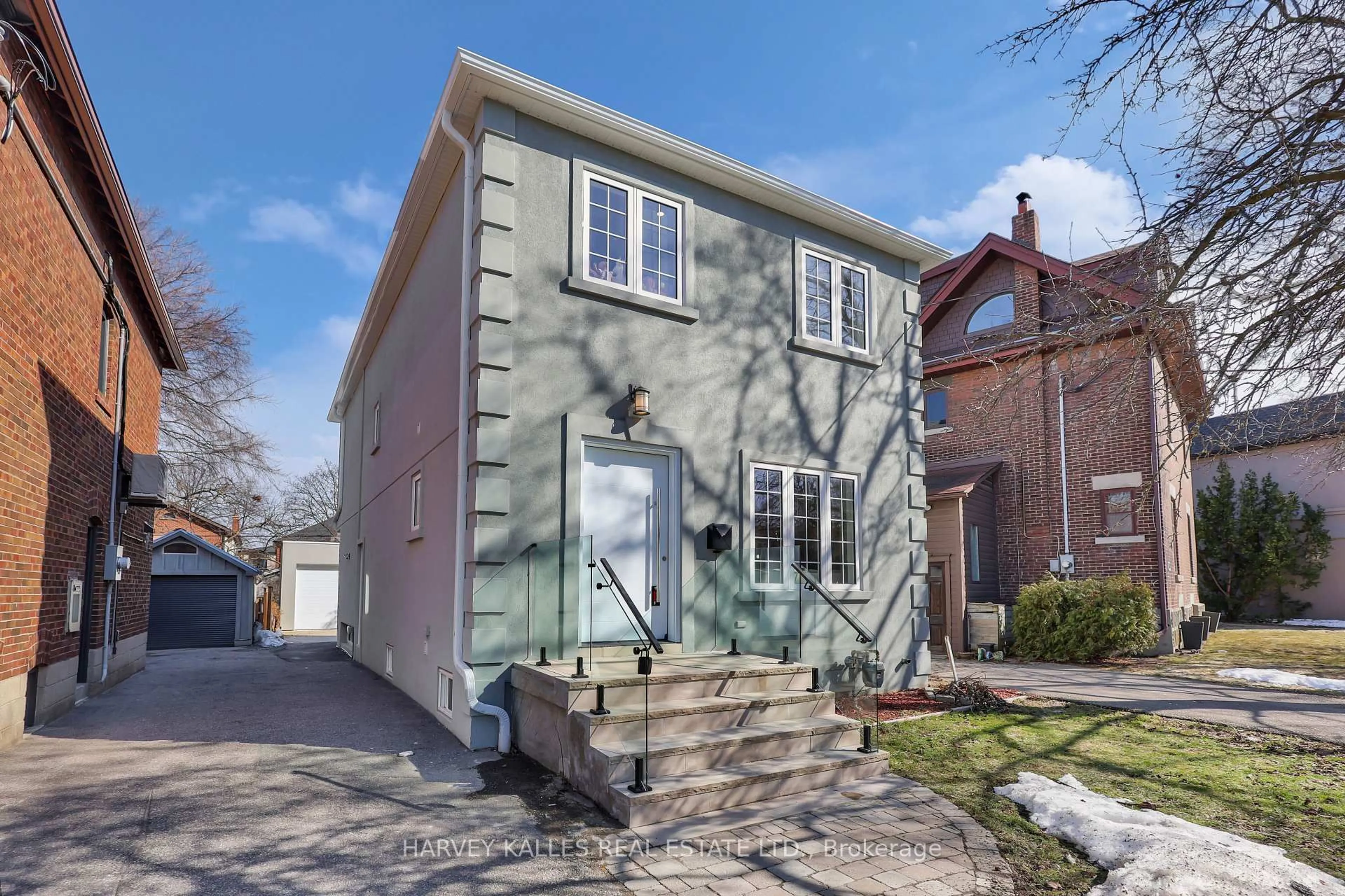 Home with brick exterior material, street for 207 Sutherland Dr, Toronto Ontario M4G 1J1