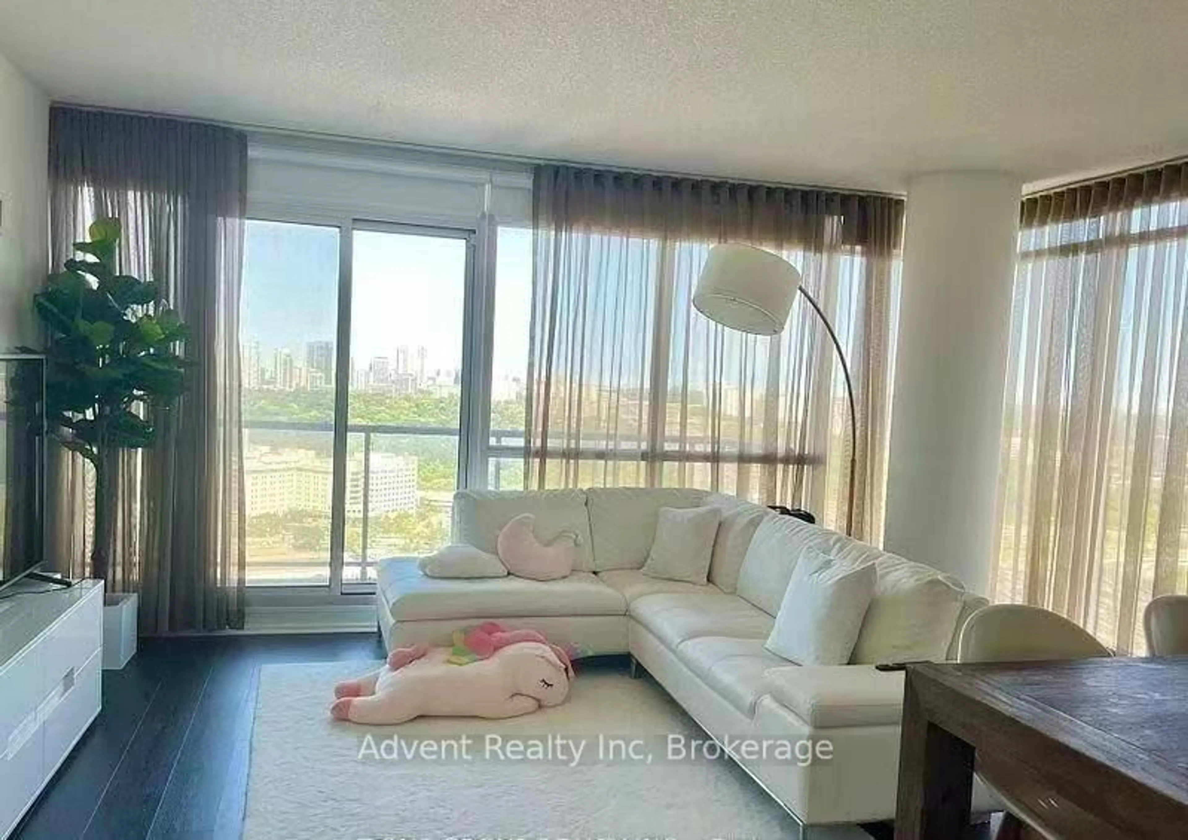 Living room with furniture, wood/laminate floor for 121 Mcmahon Dr #3208, Toronto Ontario M2K 0C1