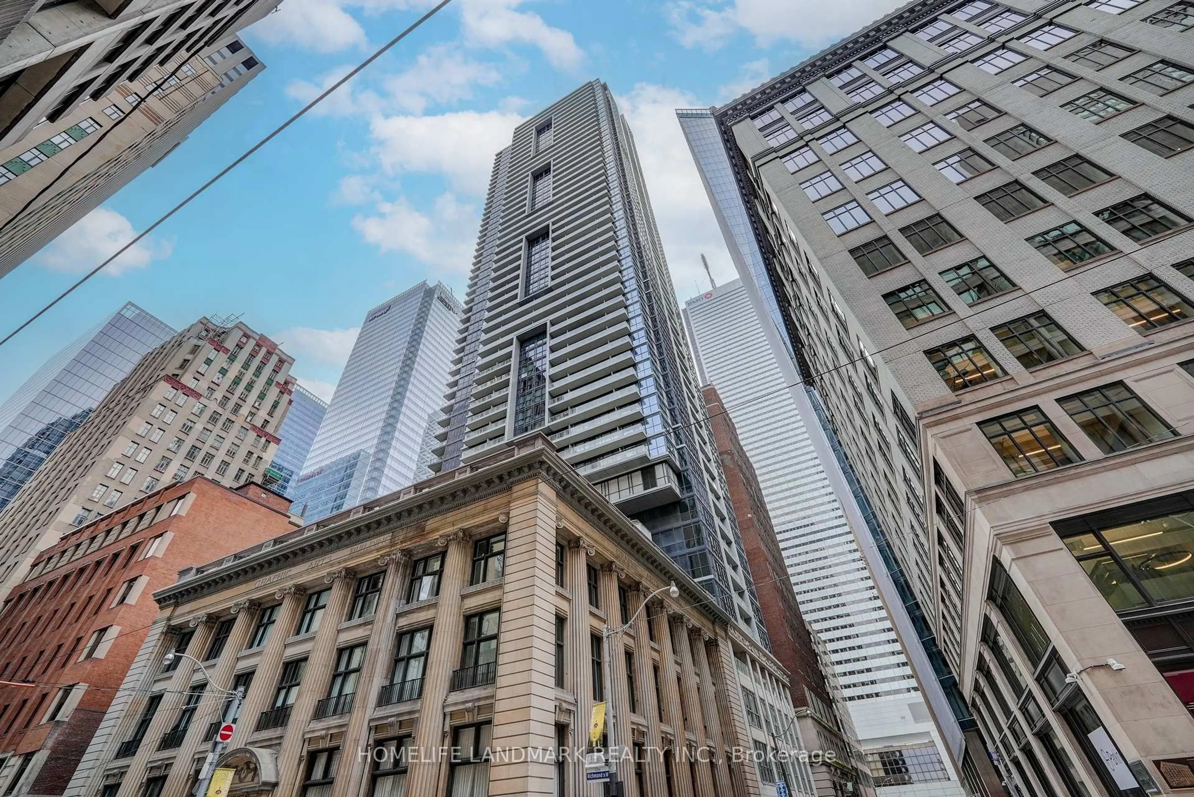 Patio, city buildings view from balcony for 70 Temperance St #1611, Toronto Ontario M5H 4E8