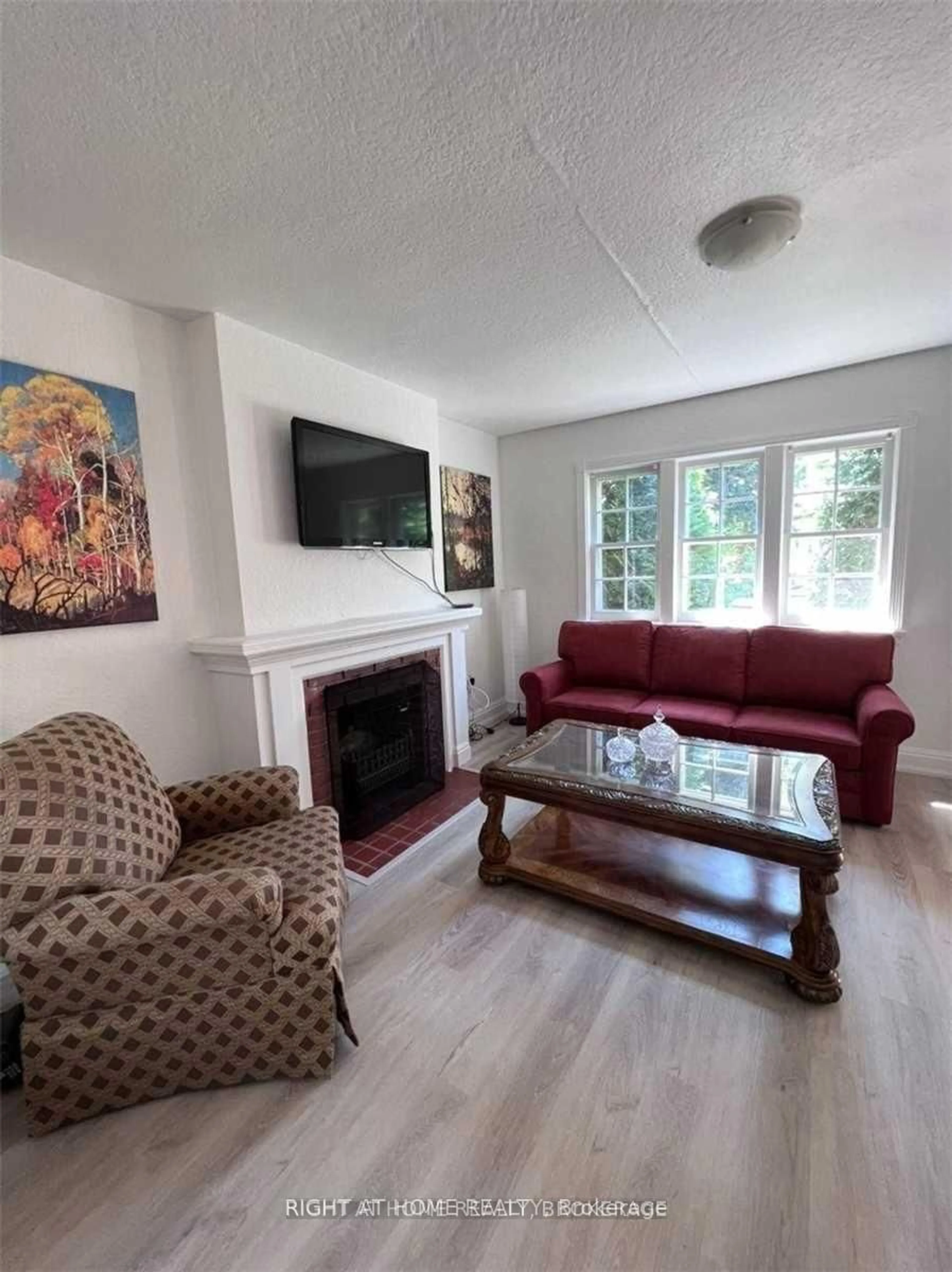 Living room with furniture, wood/laminate floor for 280 Woburn Ave, Toronto Ontario M5M 1K9