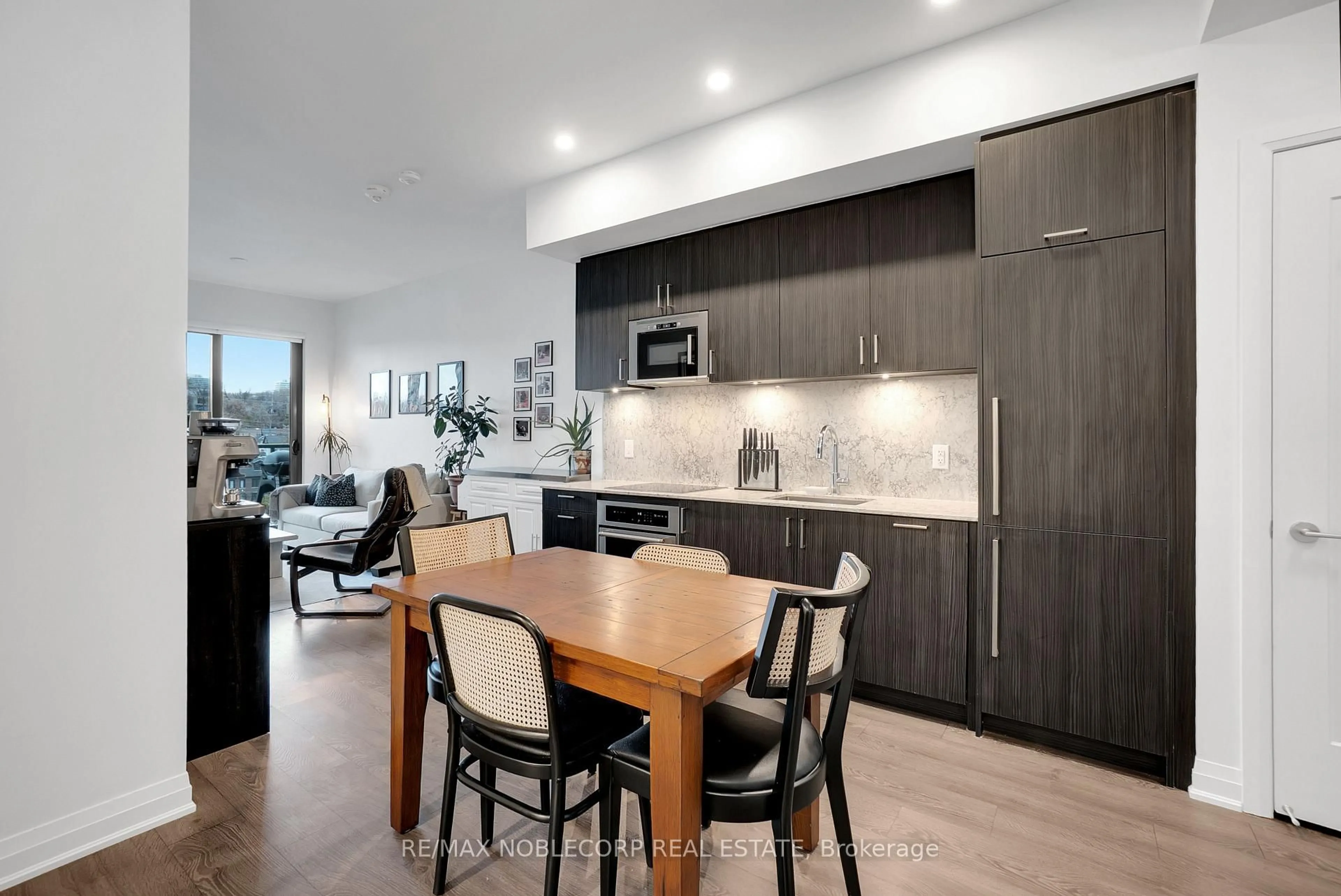 Open concept kitchen, wood/laminate floor for 280 Howland Ave #531, Toronto Ontario M5R 0C3