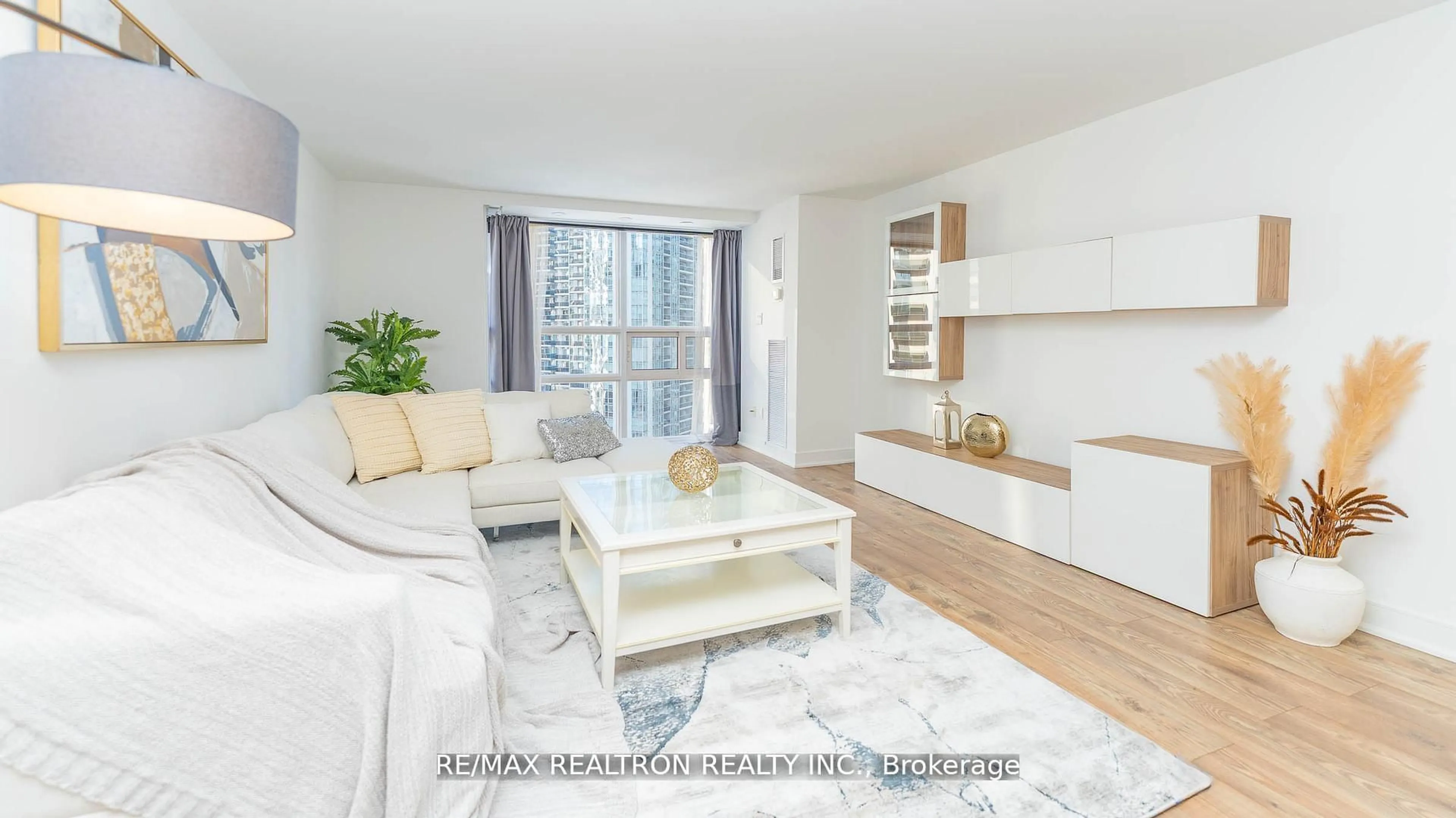 Living room with furniture, wood/laminate floor for 131 Beecroft Rd #1505, Toronto Ontario M2N 6G9