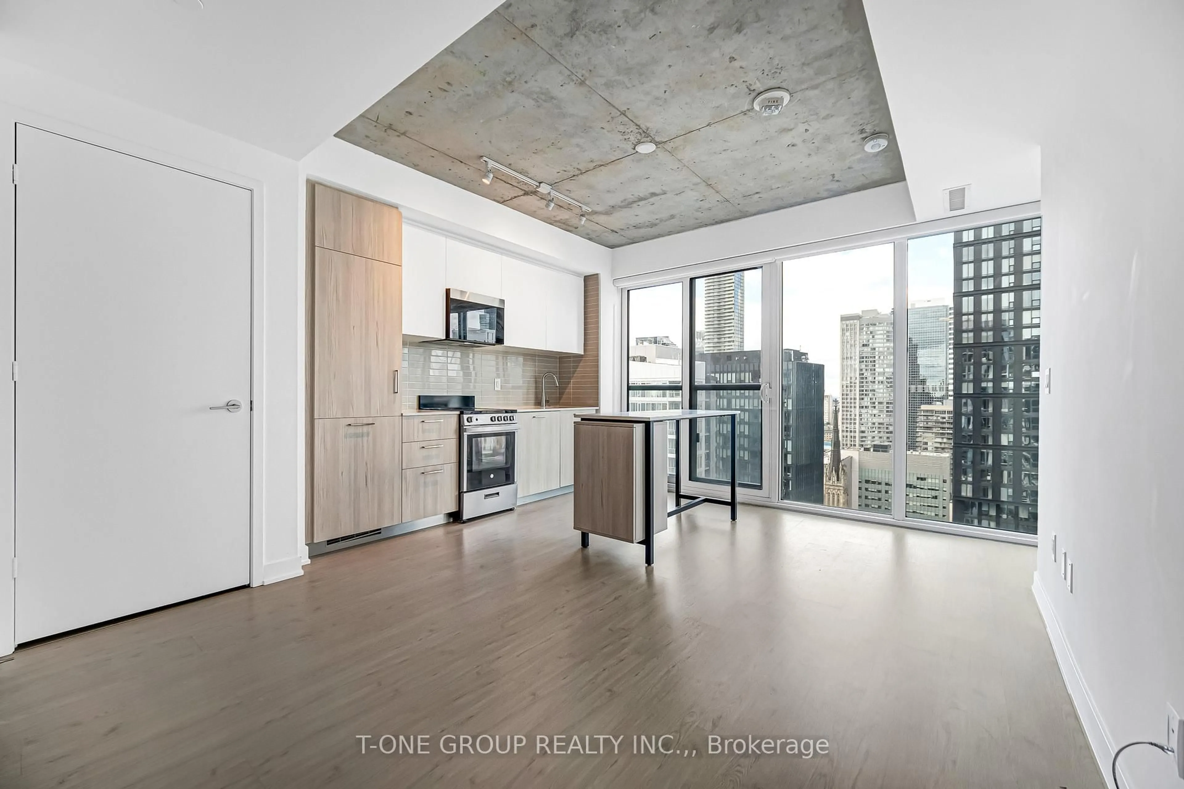 Open concept kitchen, cement floor for 65 Mutual St #2605, Toronto Ontario M5B 2A9