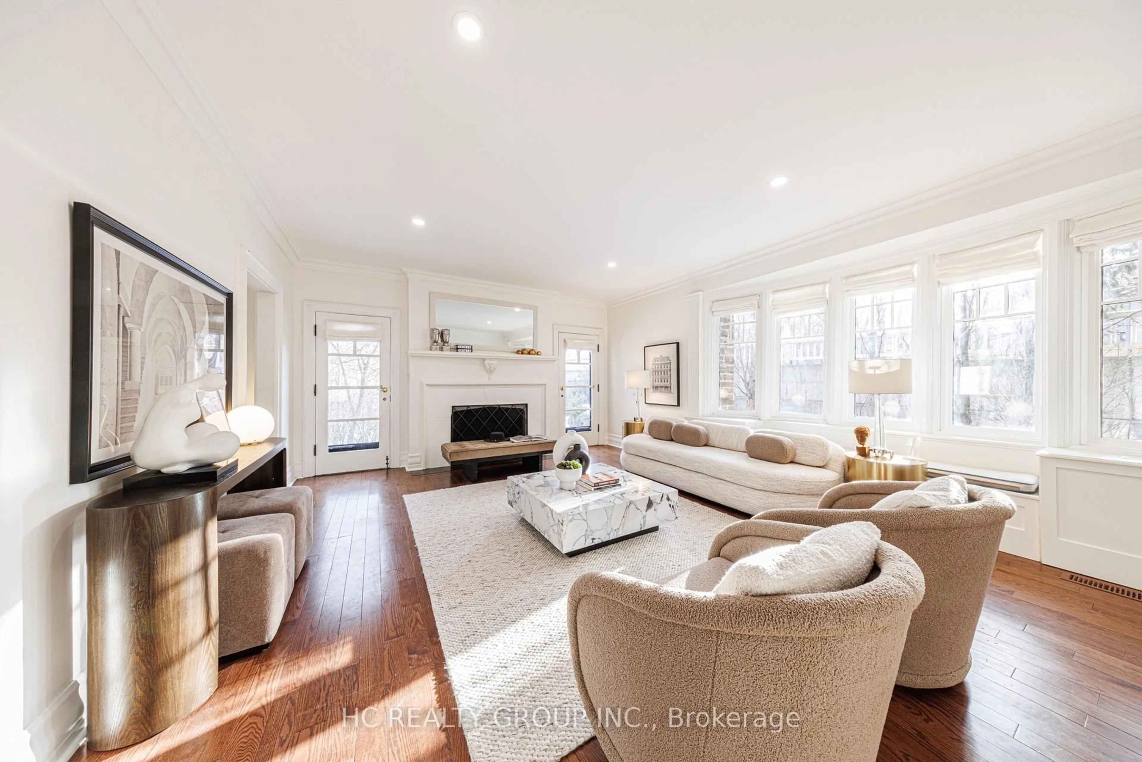 Living room with furniture, wood/laminate floor for 39 Glengowan Rd, Toronto Ontario M4N 1G1