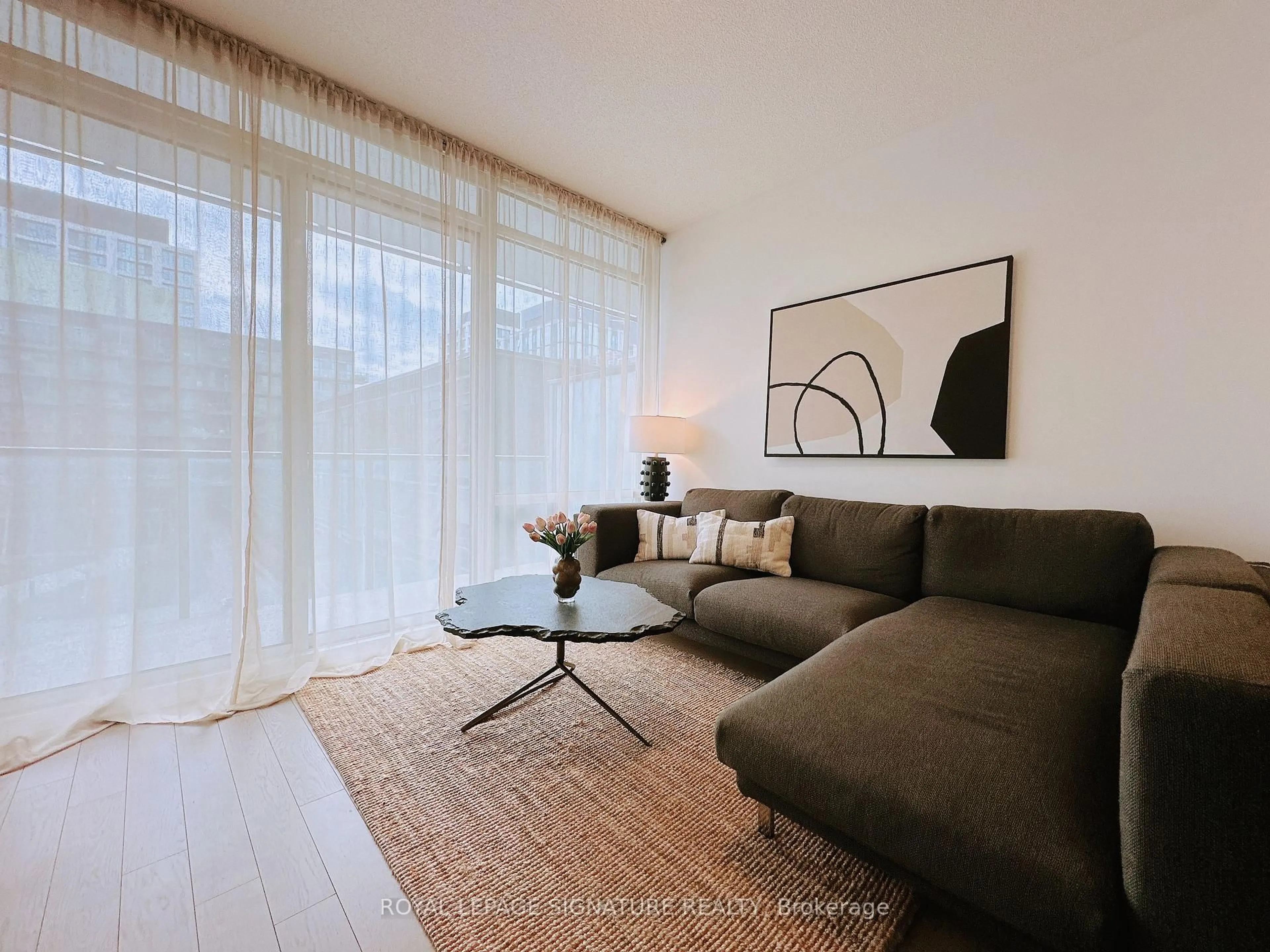 Living room with furniture, wood/laminate floor for 455 Front St #N431, Toronto Ontario M5A 0G2