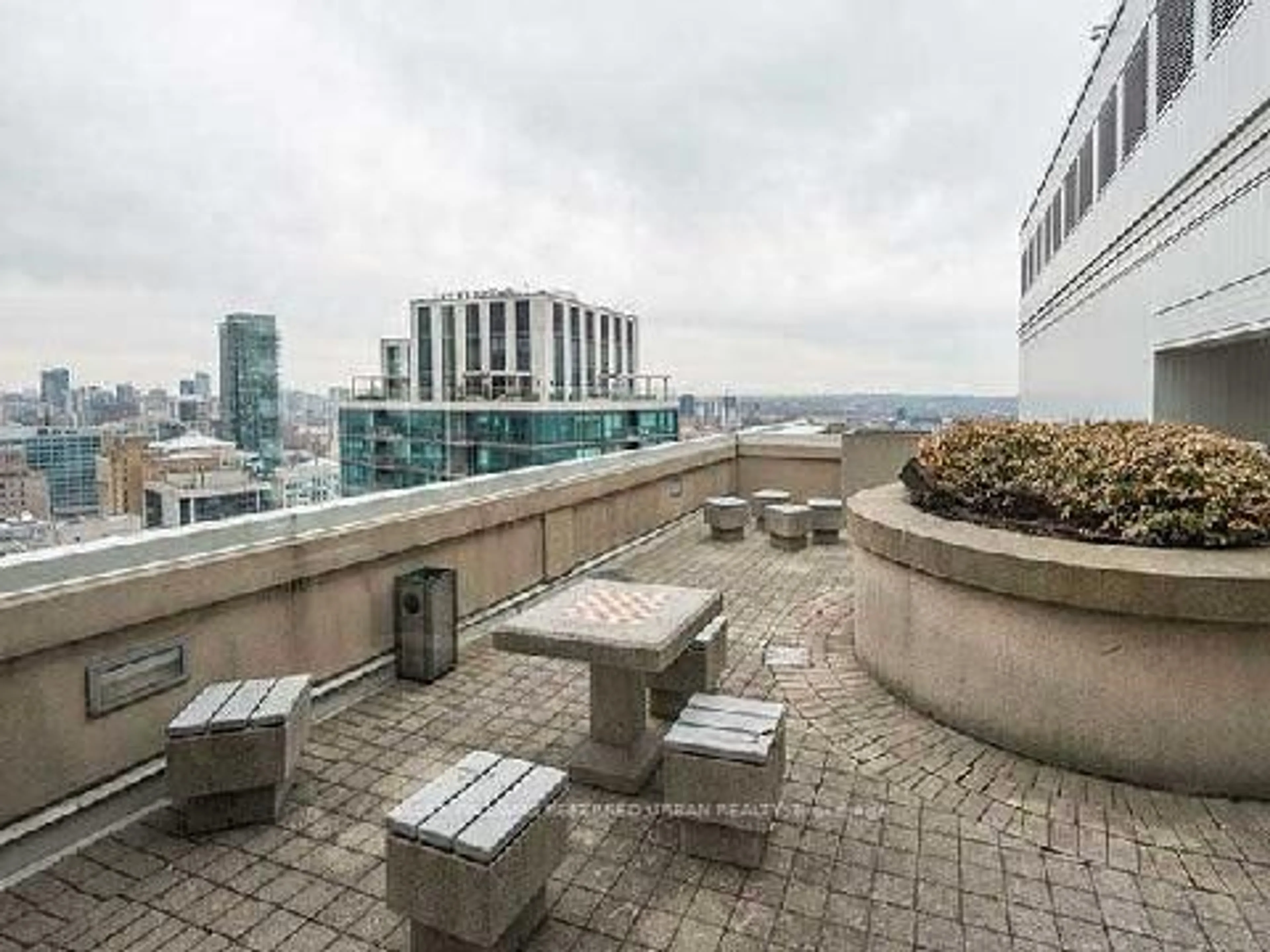 Patio, city buildings view from balcony for 25 The Esplanade #2212, Toronto Ontario M5E 1W5