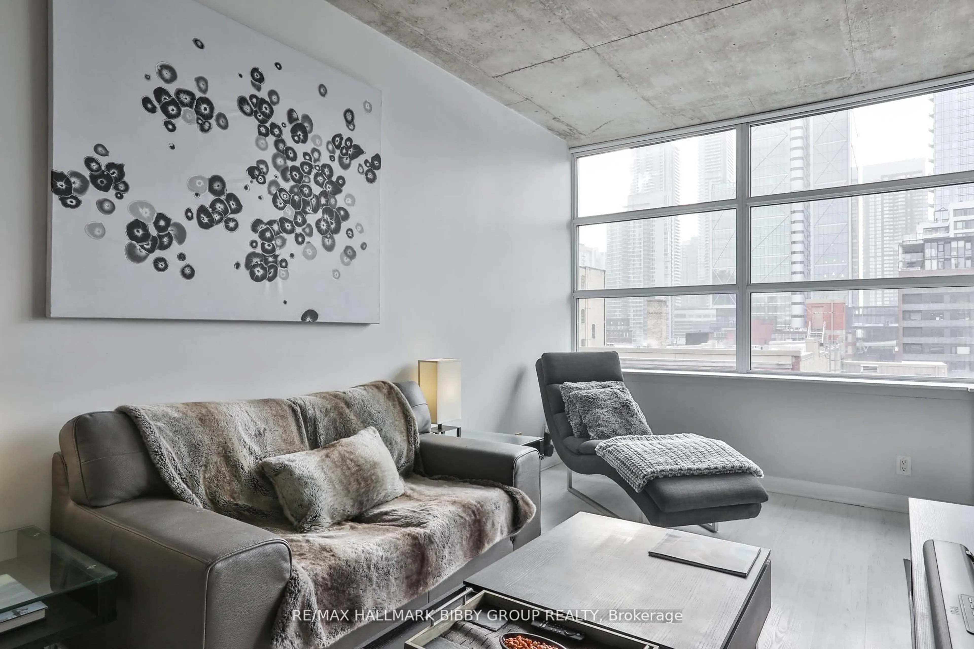 Living room with furniture, cement floor for 478 King St #606, Toronto Ontario M5V 0A8