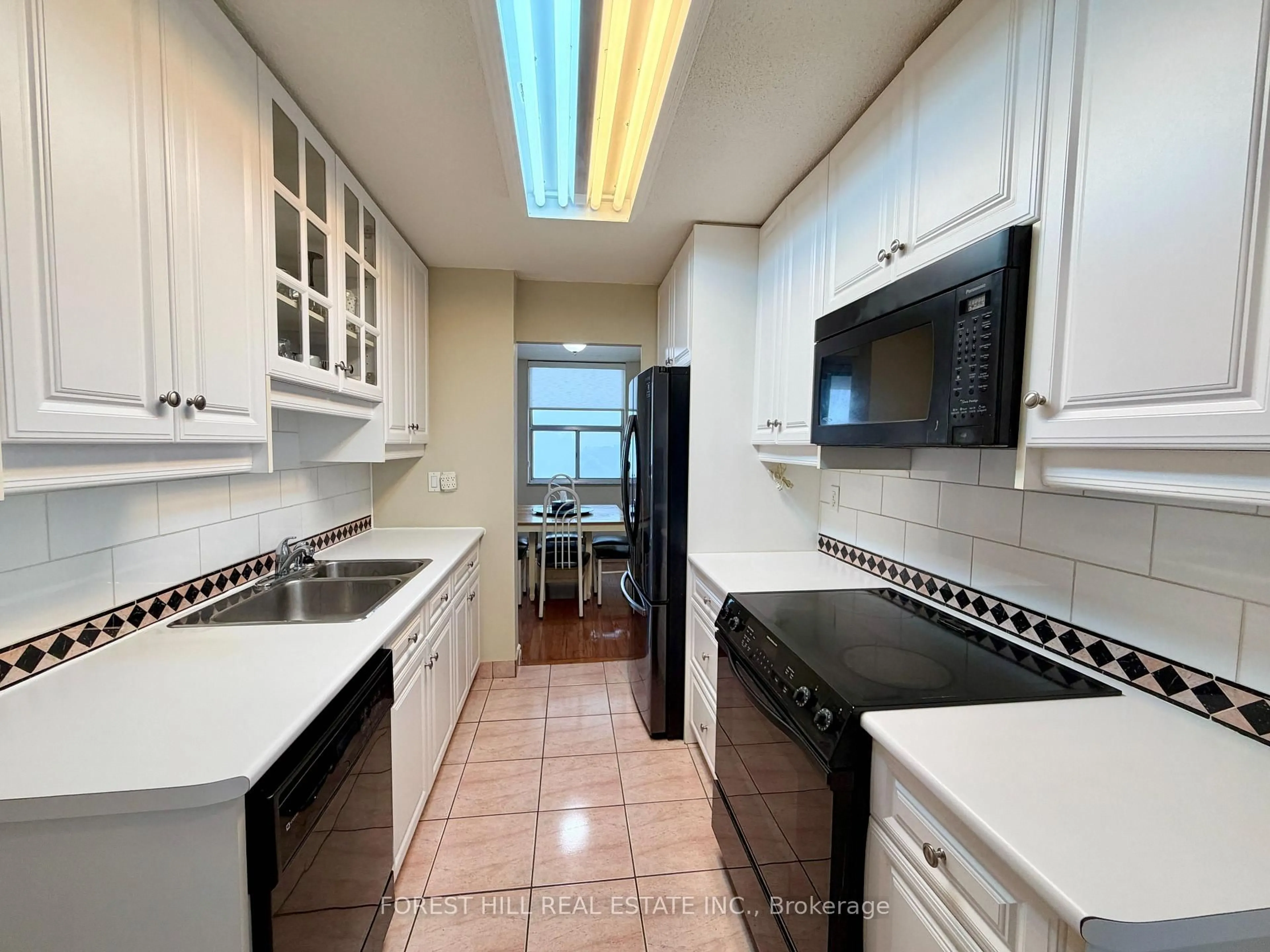 Kitchen with laundary machines, ceramic/tile floor for 205 Hilda Ave #1903, Toronto Ontario M2M 4B1