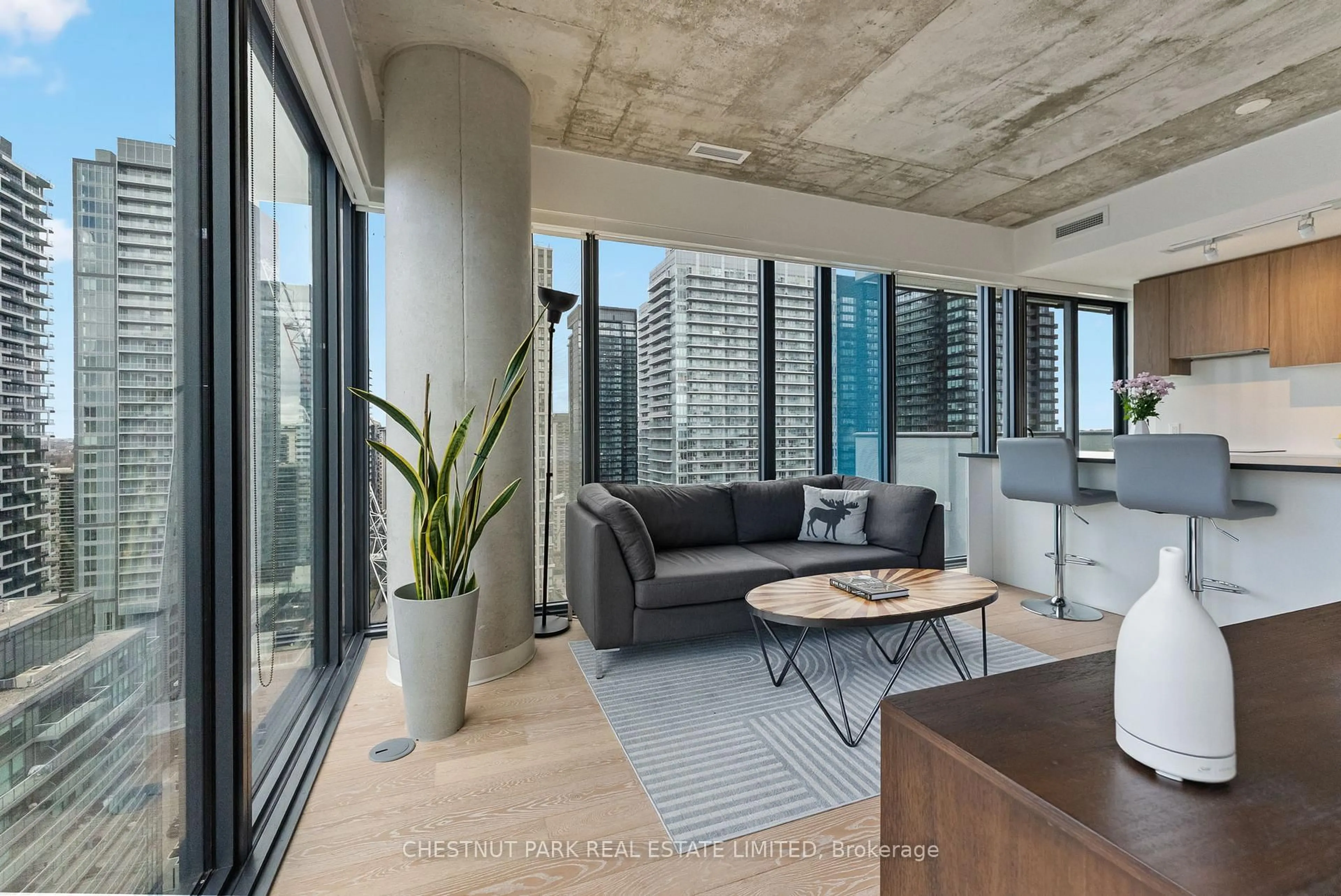 Living room with furniture, cement floor for 161 Roehampton Ave #2303, Toronto Ontario M4P 0C8