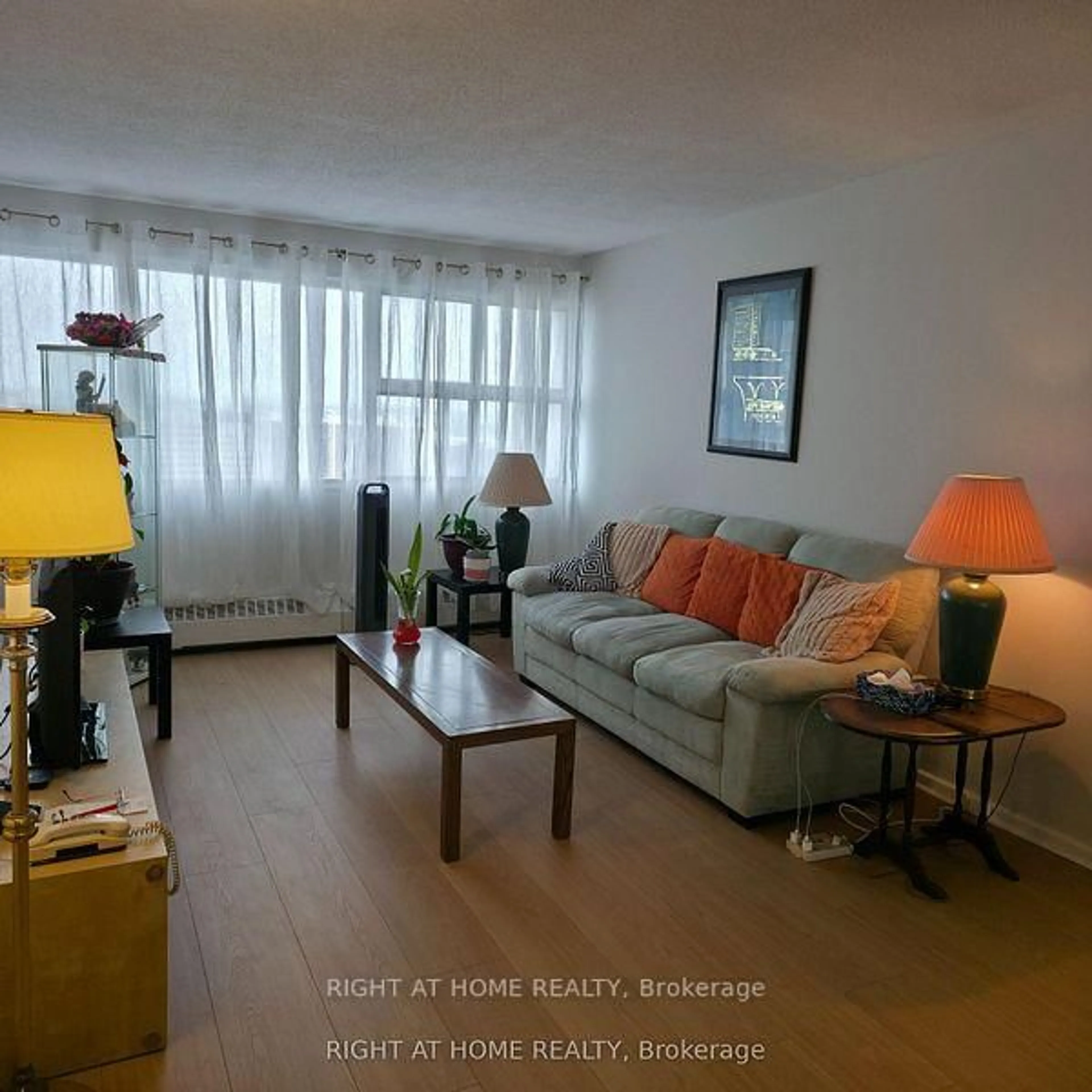 Living room with furniture, wood/laminate floor for 715 Don Mills Rd #2504, Toronto Ontario M3C 1S5