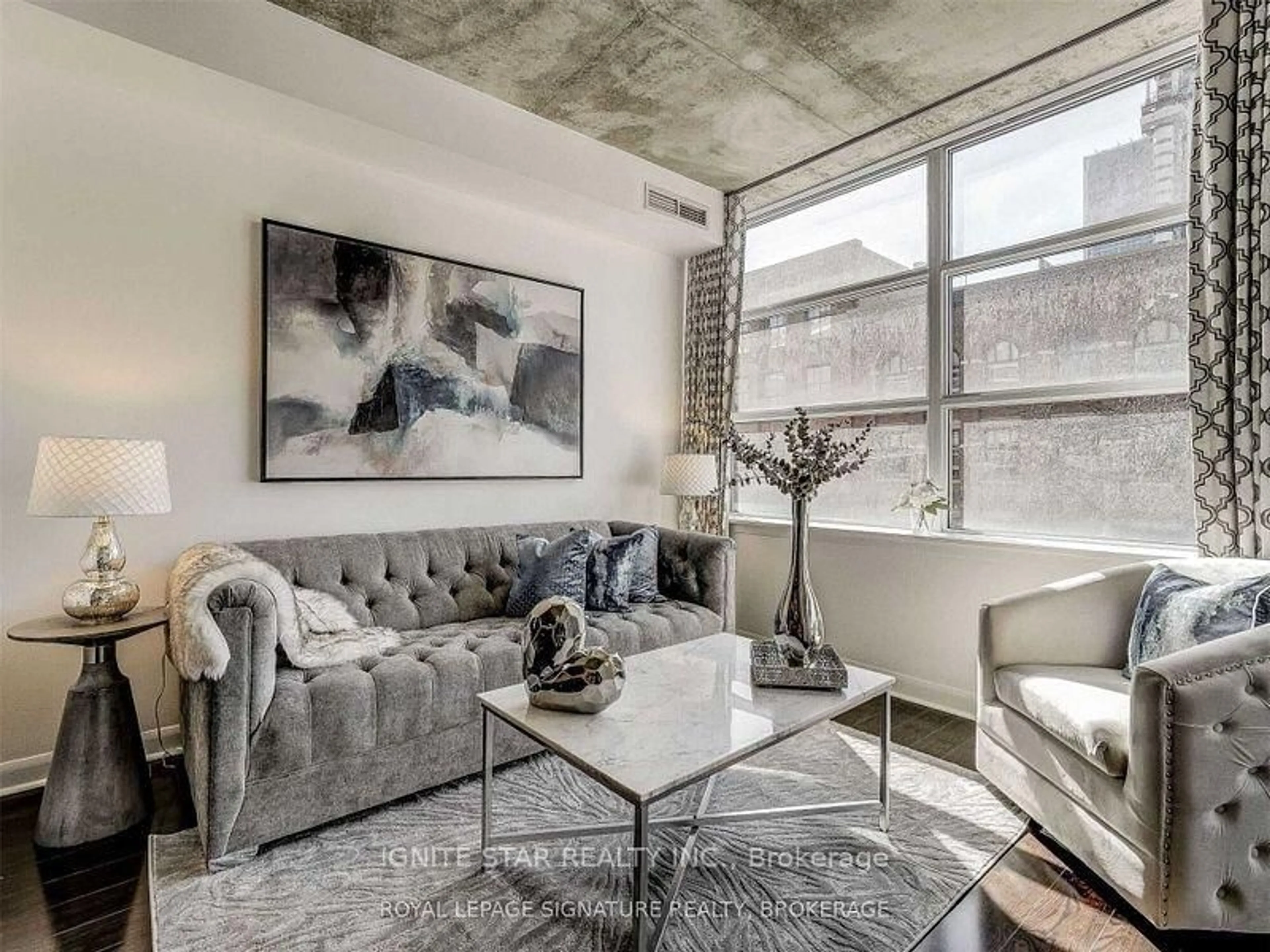 Living room with furniture, cement floor for 478 King St #209, Toronto Ontario M5V 0A8