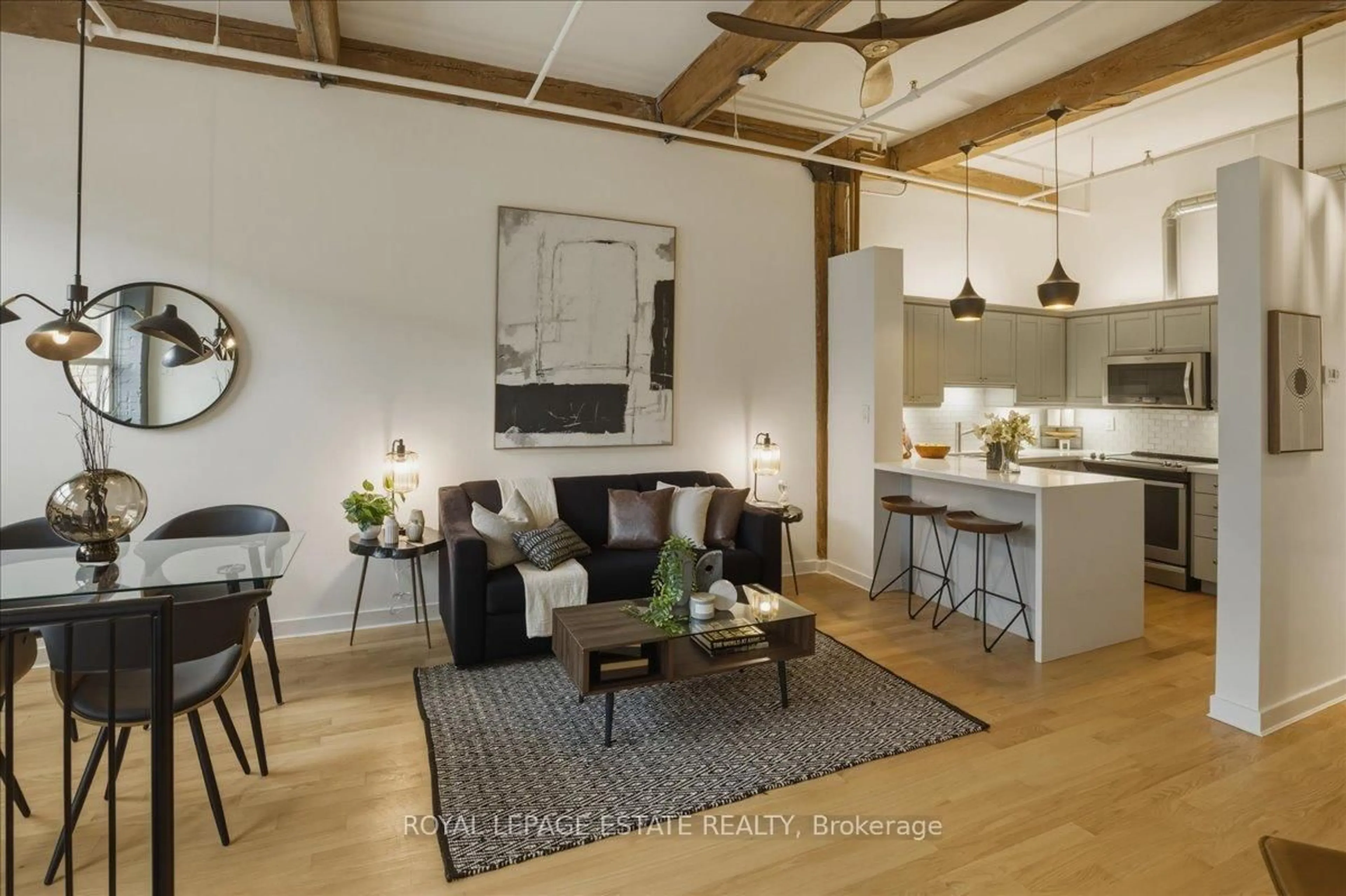 Open concept kitchen, wood/laminate floor for 284 St Helen's Ave #105, Toronto Ontario M6H 4A4