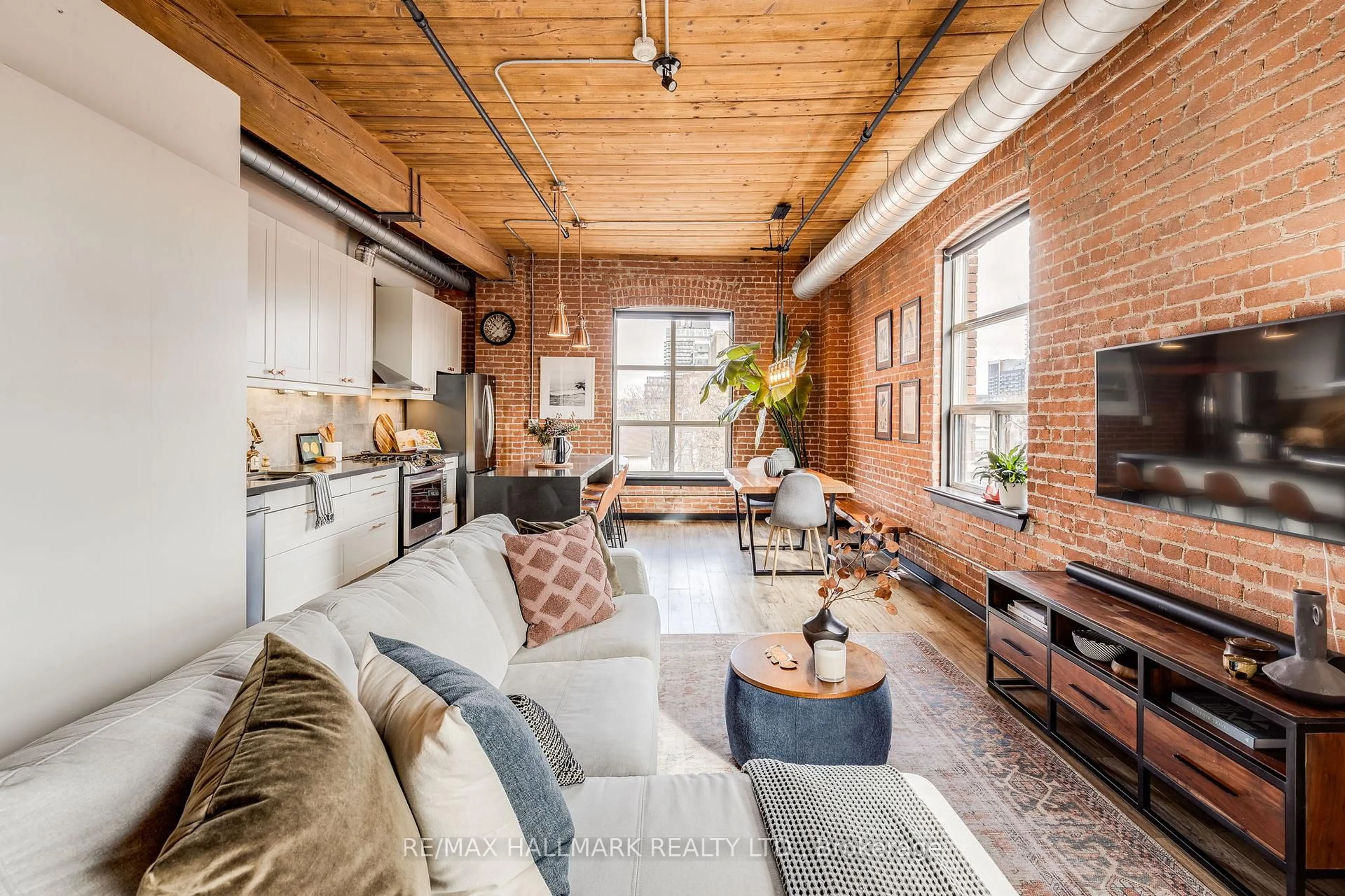 Living room with furniture, cement floor for 426 Queen St #406, Toronto Ontario M5A 1T4