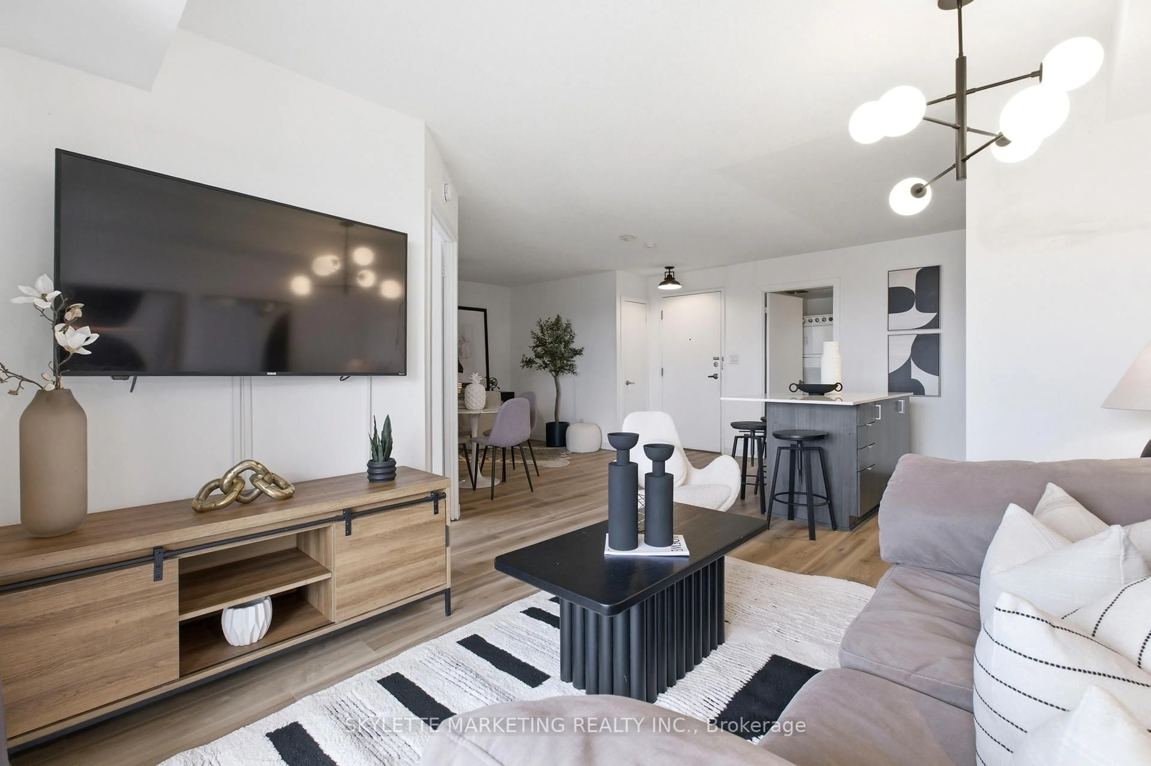 Living room with furniture, wood/laminate floor for 801 Sheppard Ave #701, Toronto Ontario M3H 0A8