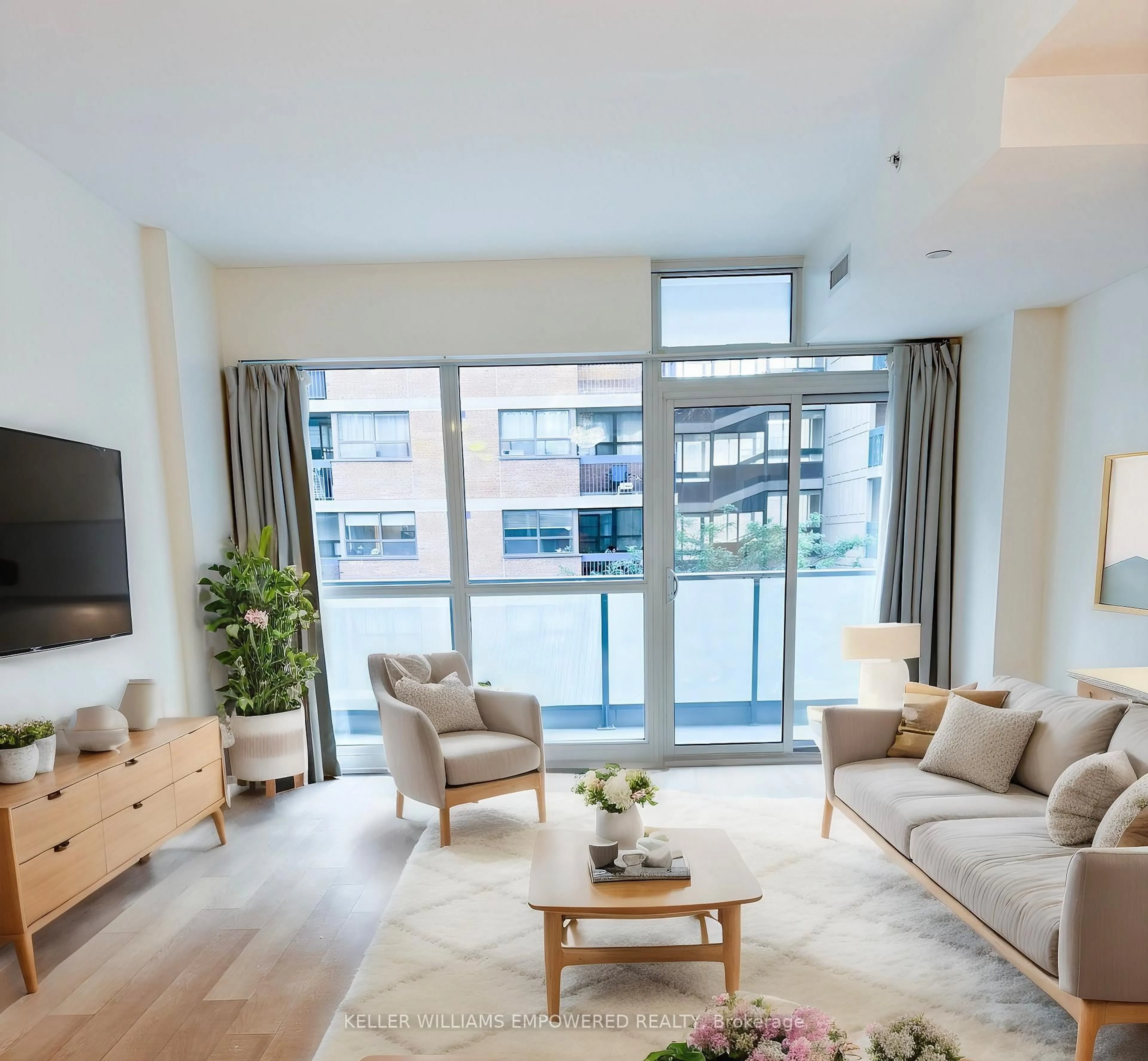 Living room with furniture, wood/laminate floor for 210 Simcoe St #406, Toronto Ontario M5T 0A9