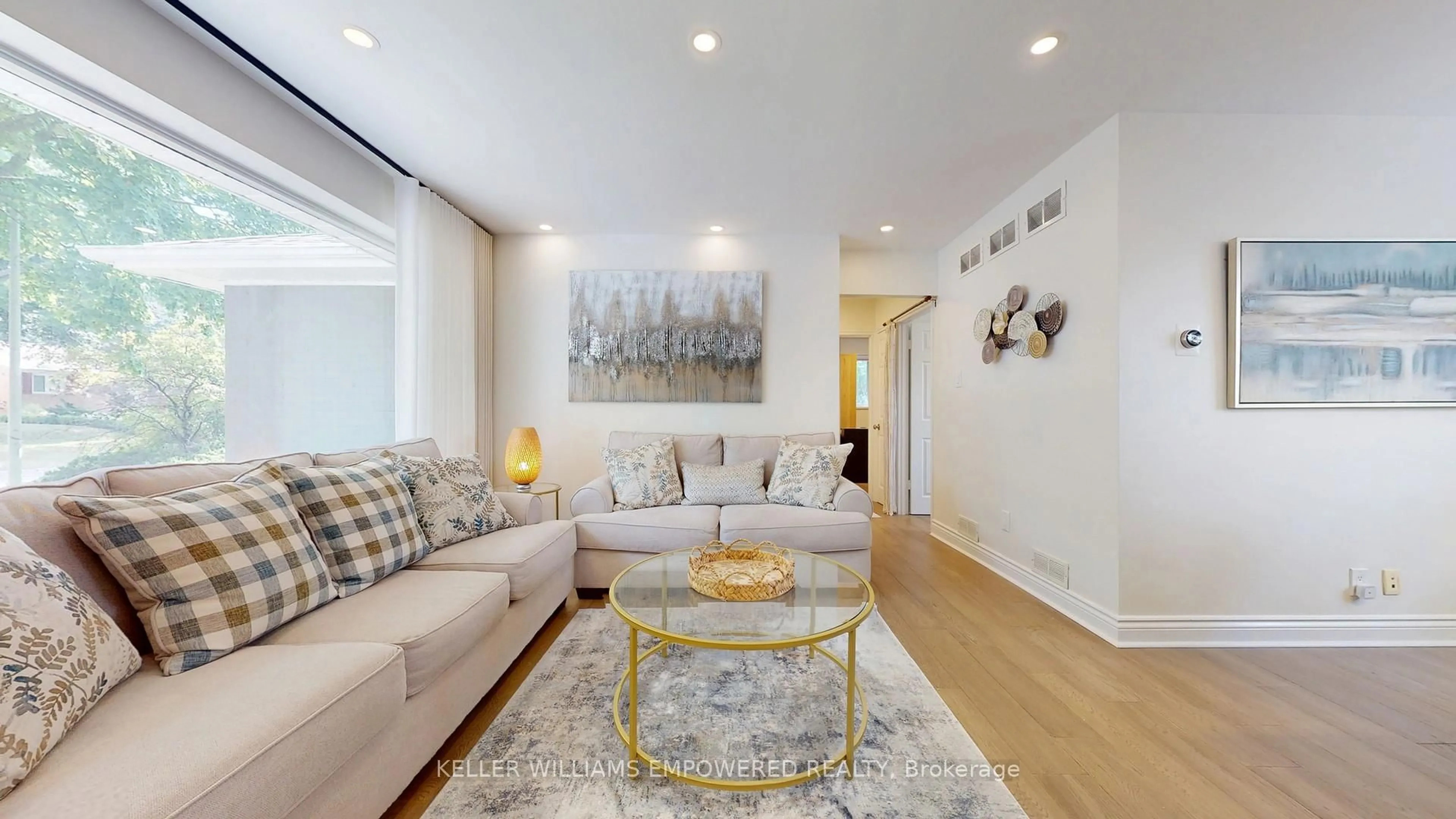 Living room with furniture, wood/laminate floor for 30 Paperbirch Dr, Toronto Ontario M3C 2E7