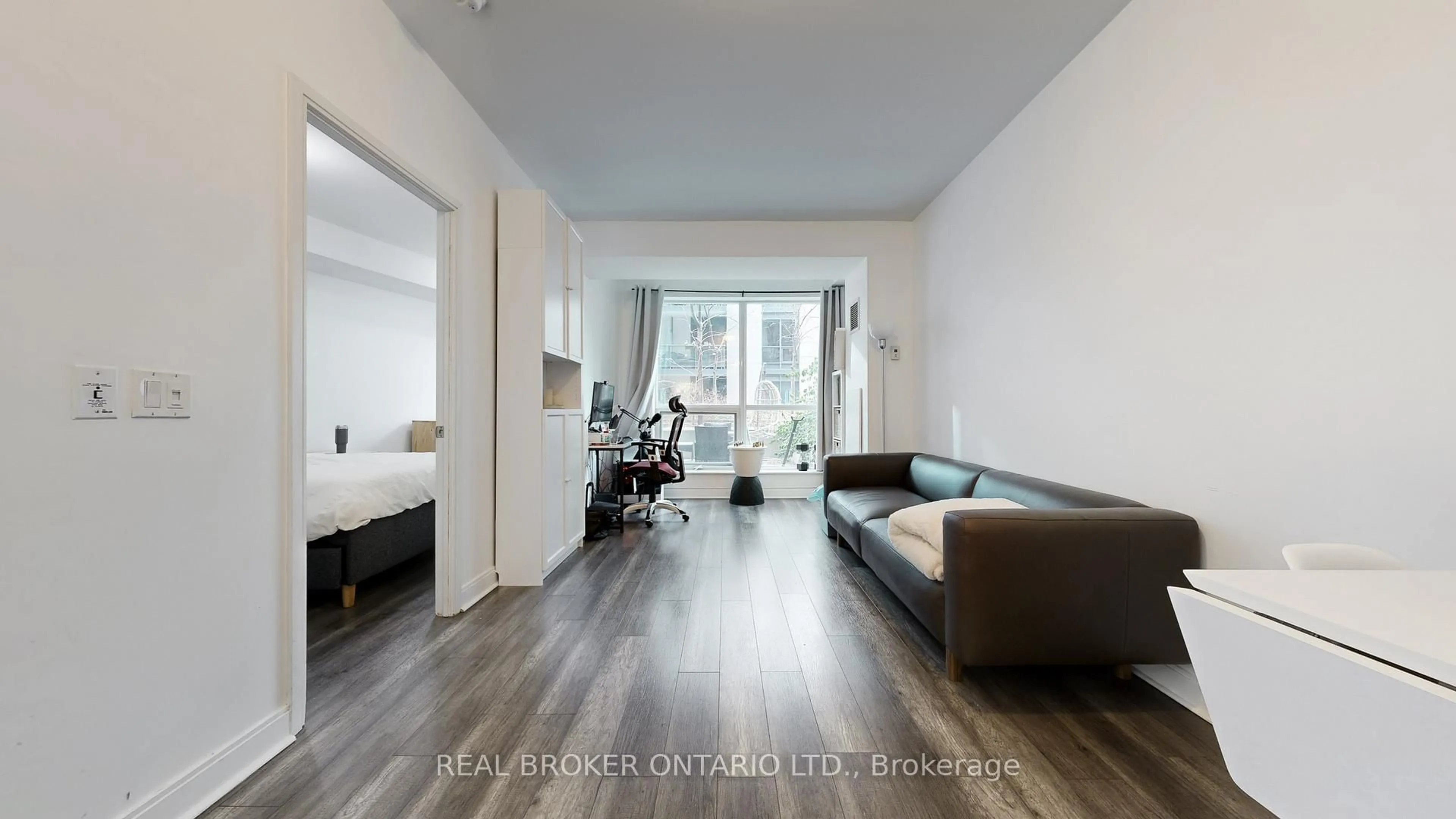 Living room with furniture, wood/laminate floor for 38 The Esplanade #313, Toronto Ontario M5E 1A5