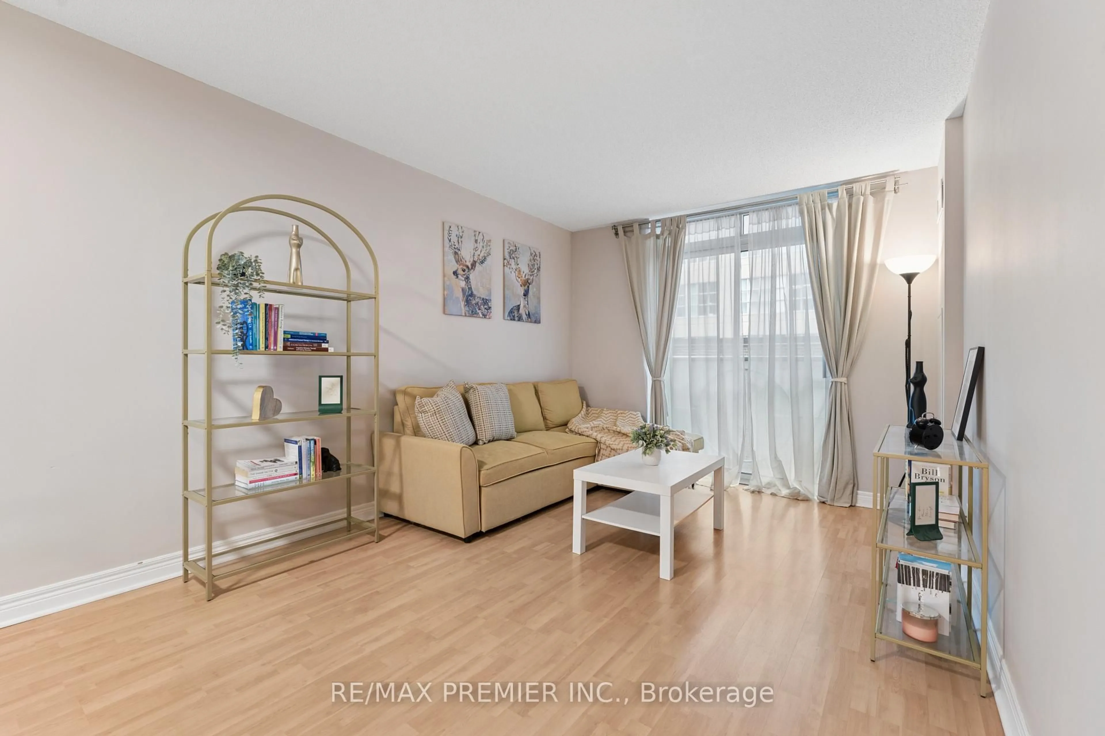 Living room with furniture, wood/laminate floor for 212 Eglinton Ave ##307, Toronto Ontario M4P 0A3