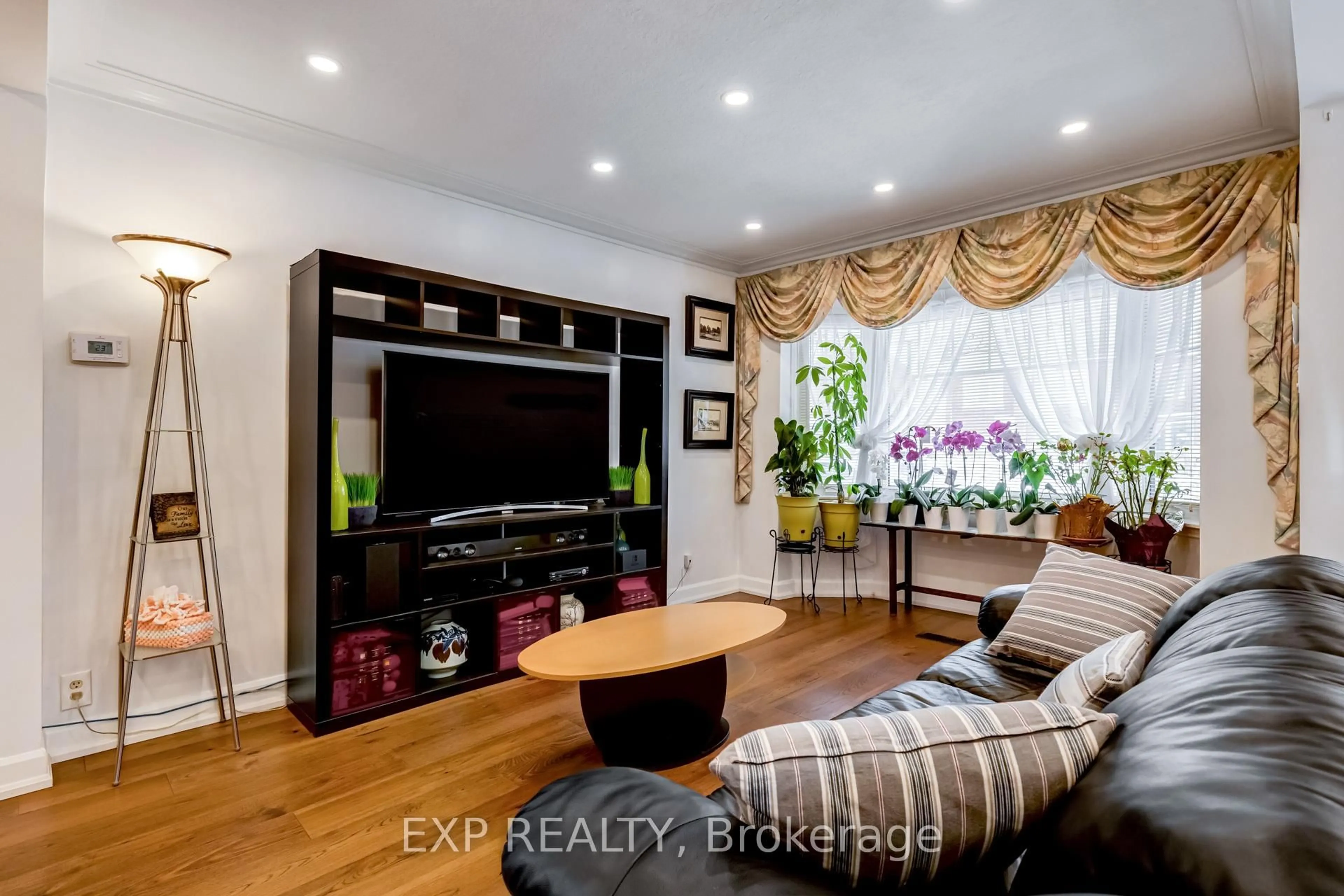 Living room with furniture, wood/laminate floor for 436 Oakwood Ave, Toronto Ontario M6E 2W5