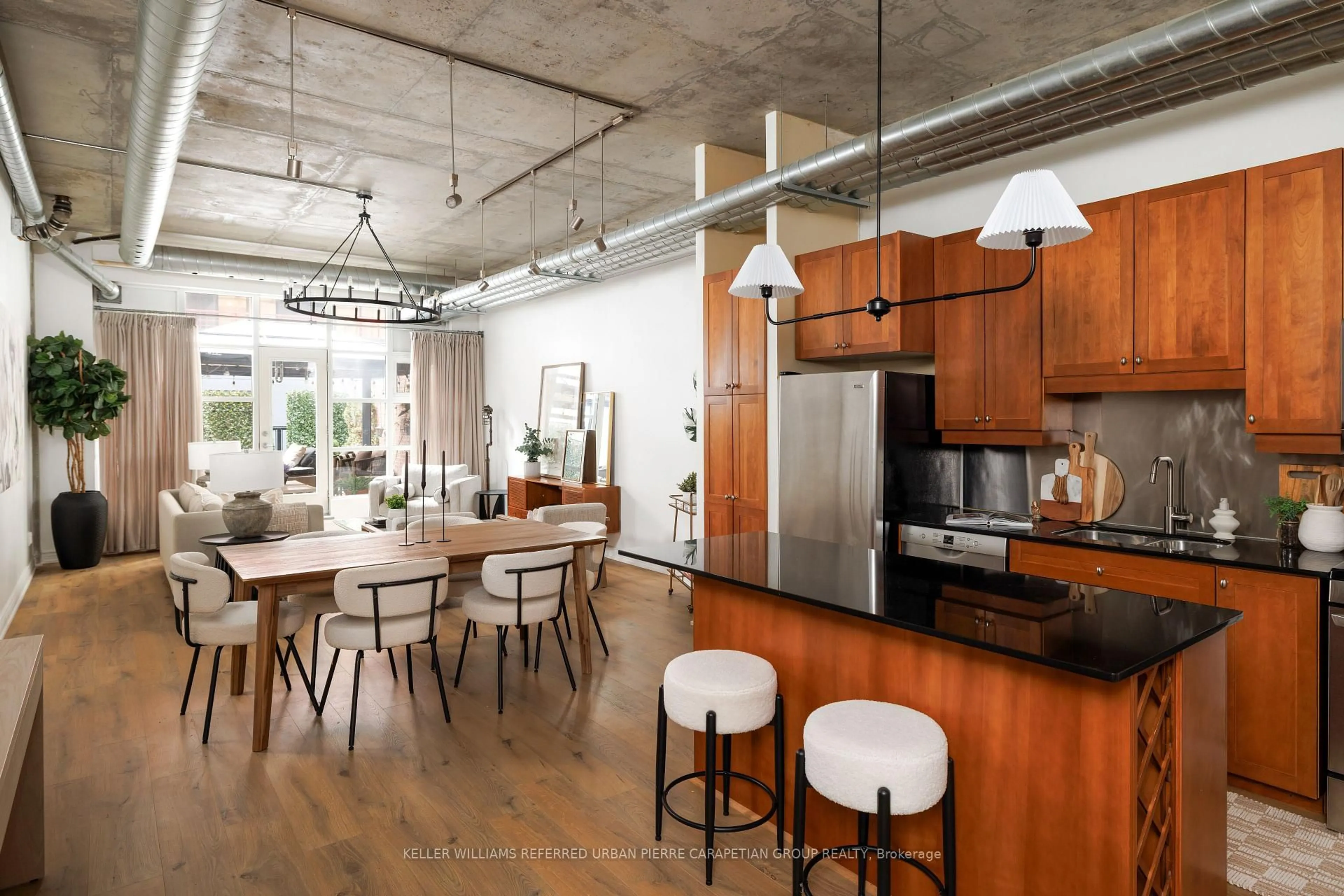 Open concept kitchen, cement floor for 261 King St #205, Toronto Ontario M5A 4T6