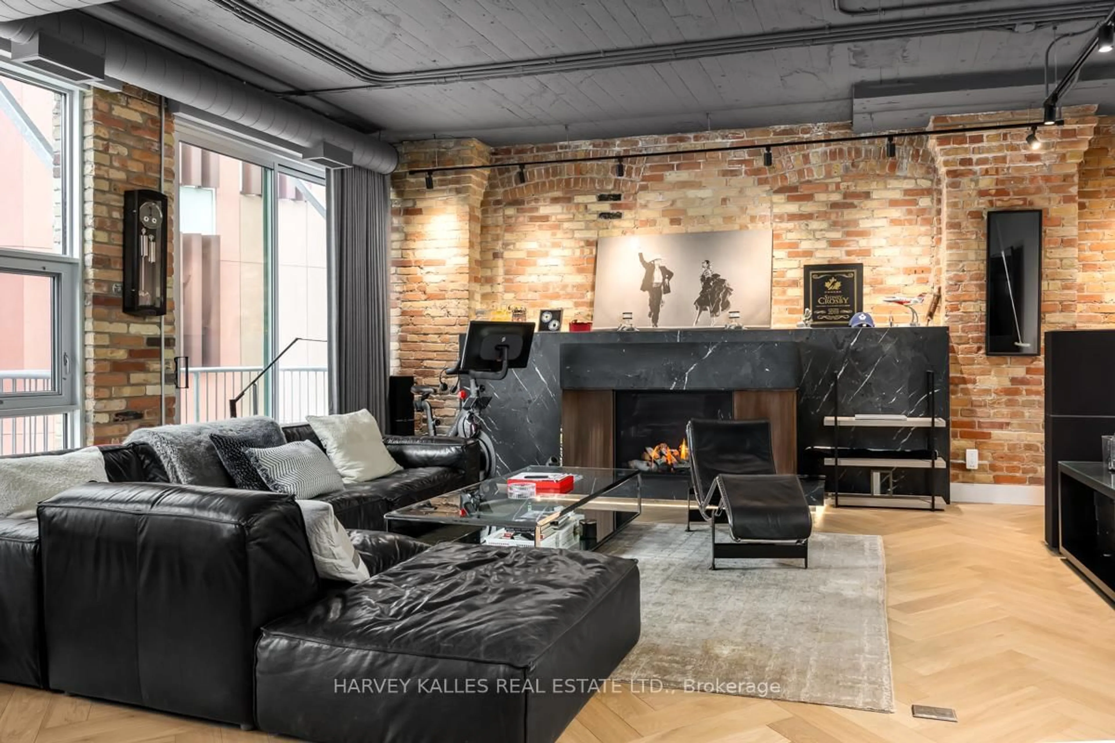 Living room with furniture, cement floor for 113 Dupont St #201, Toronto Ontario M5R 1V4