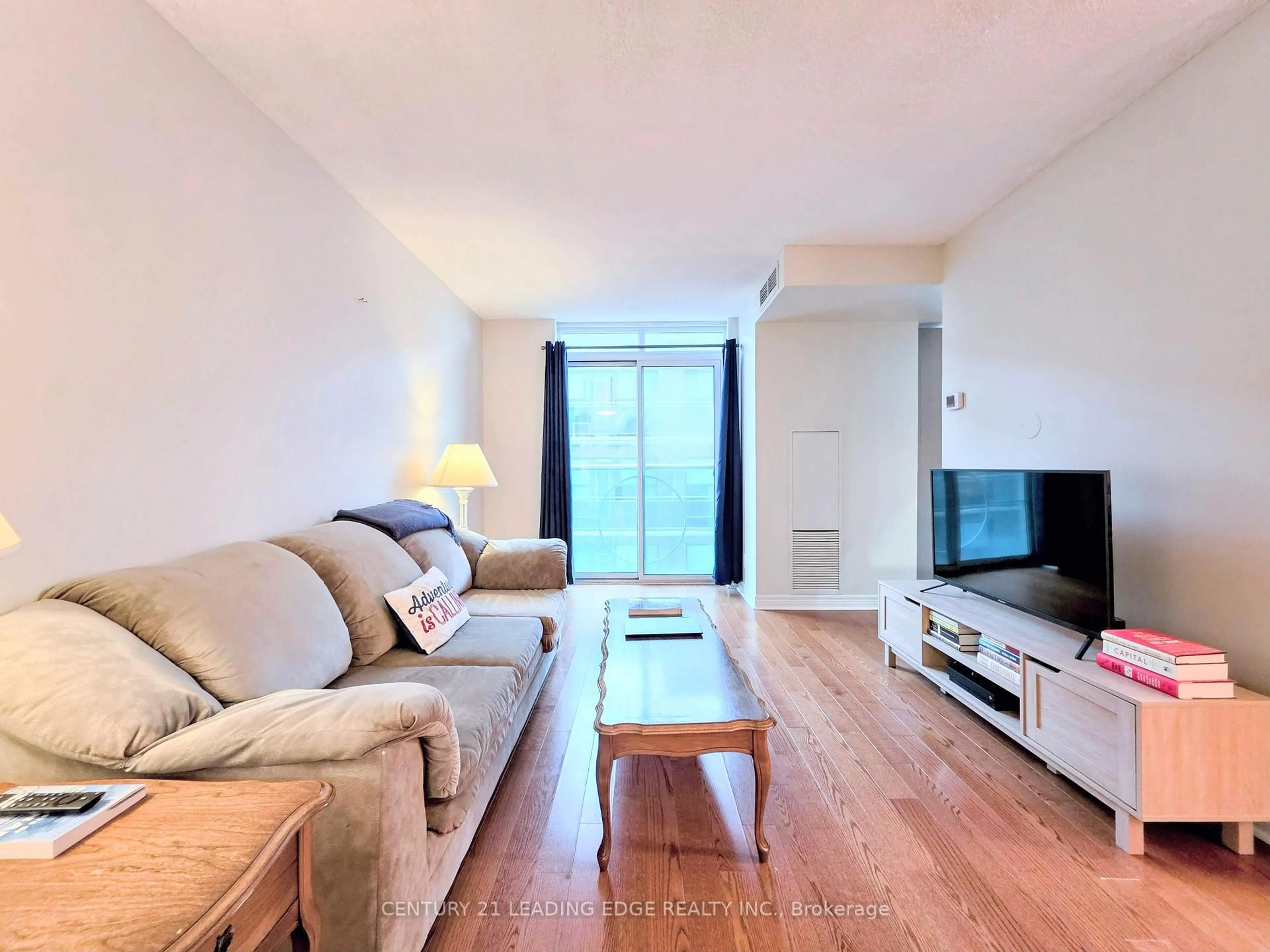 Living room with furniture, wood/laminate floor for 212 Eglinton Ave #1012, Toronto Ontario M4P 0A3