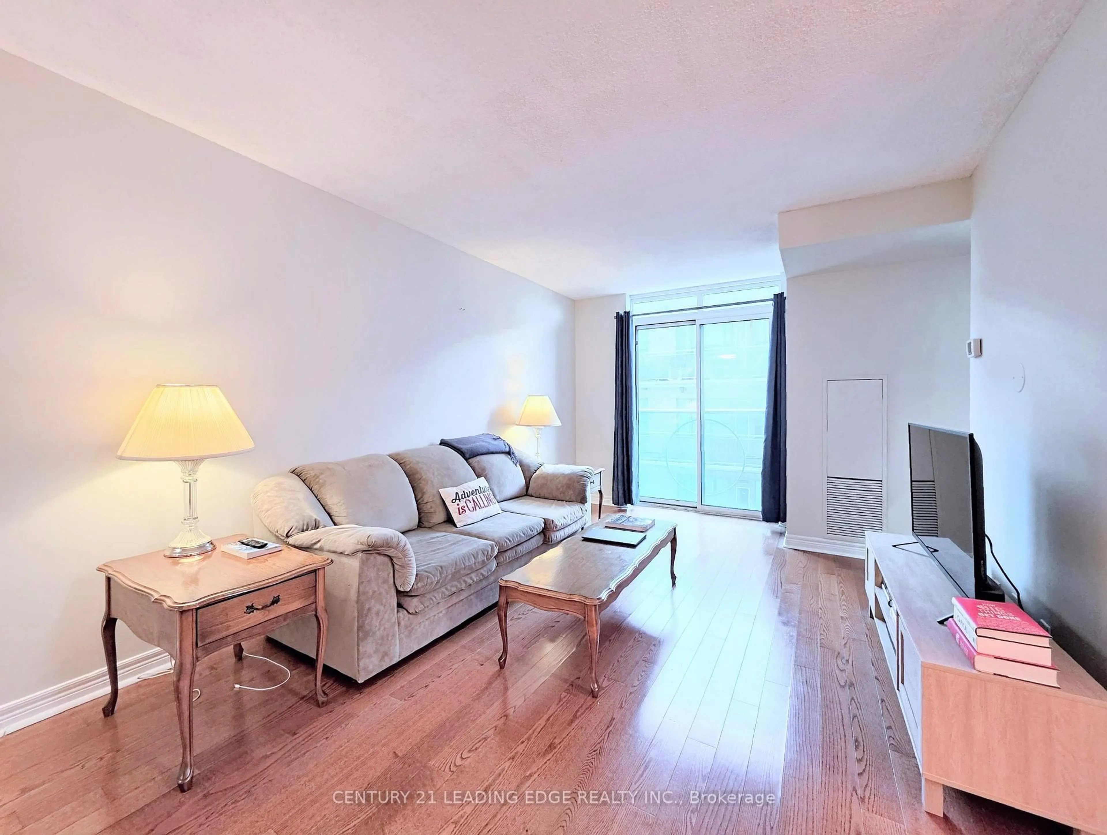 Living room with furniture, wood/laminate floor for 212 Eglinton Ave #1012, Toronto Ontario M4P 0A3
