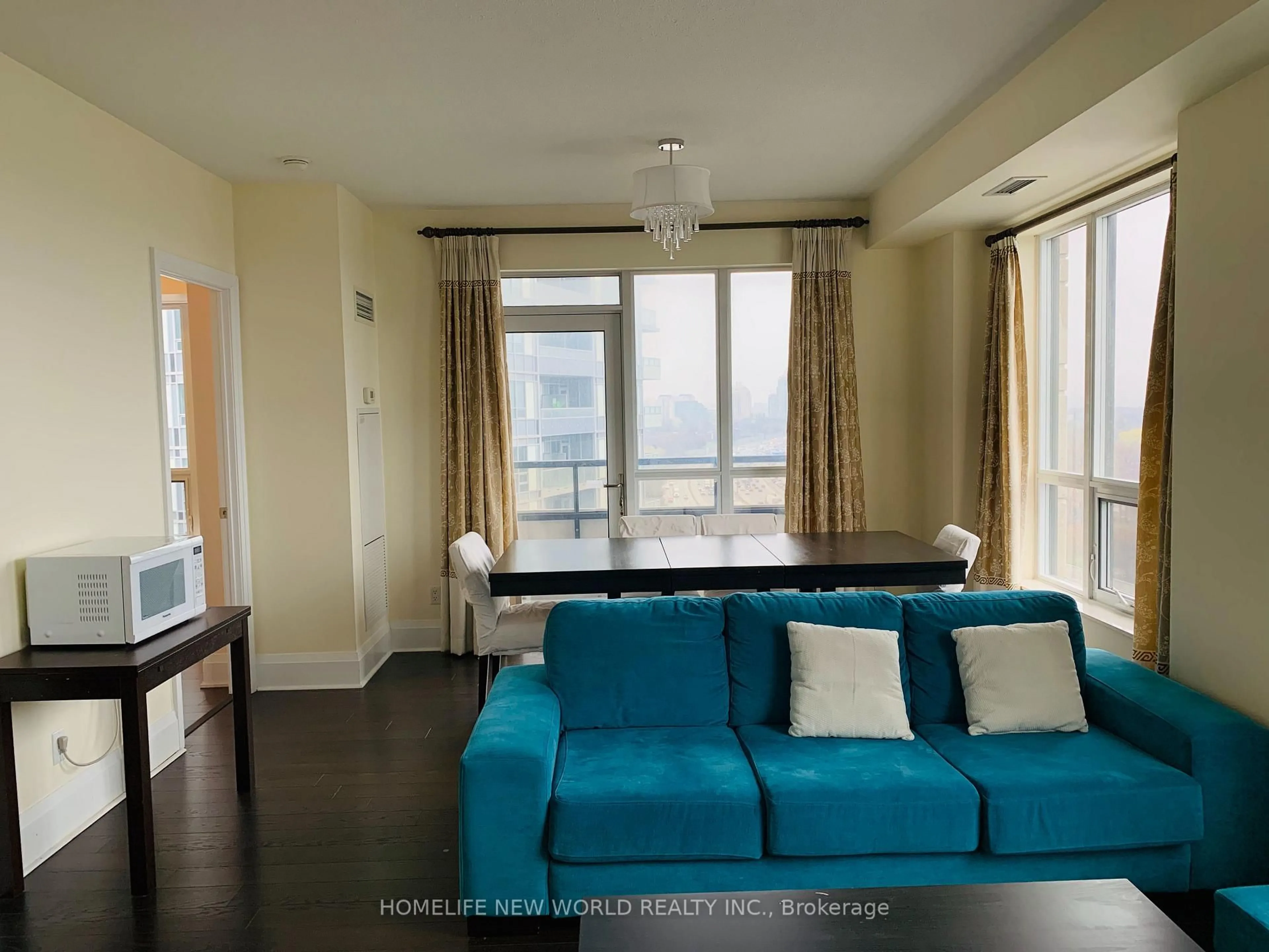 Living room with furniture, wood/laminate floor for 100 Harrison Garden Blvd #1322, Toronto Ontario M2N 0C2