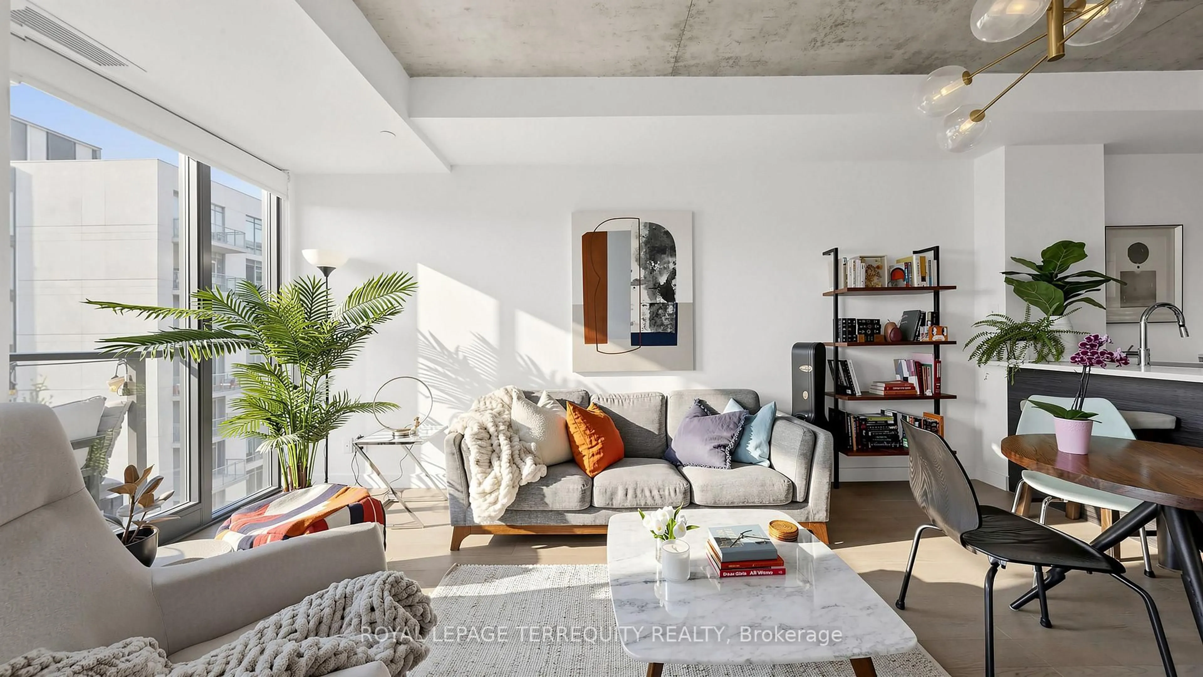 Living room with furniture, cement floor for 111 Bathurst St #1313, Toronto Ontario M5V 0M9