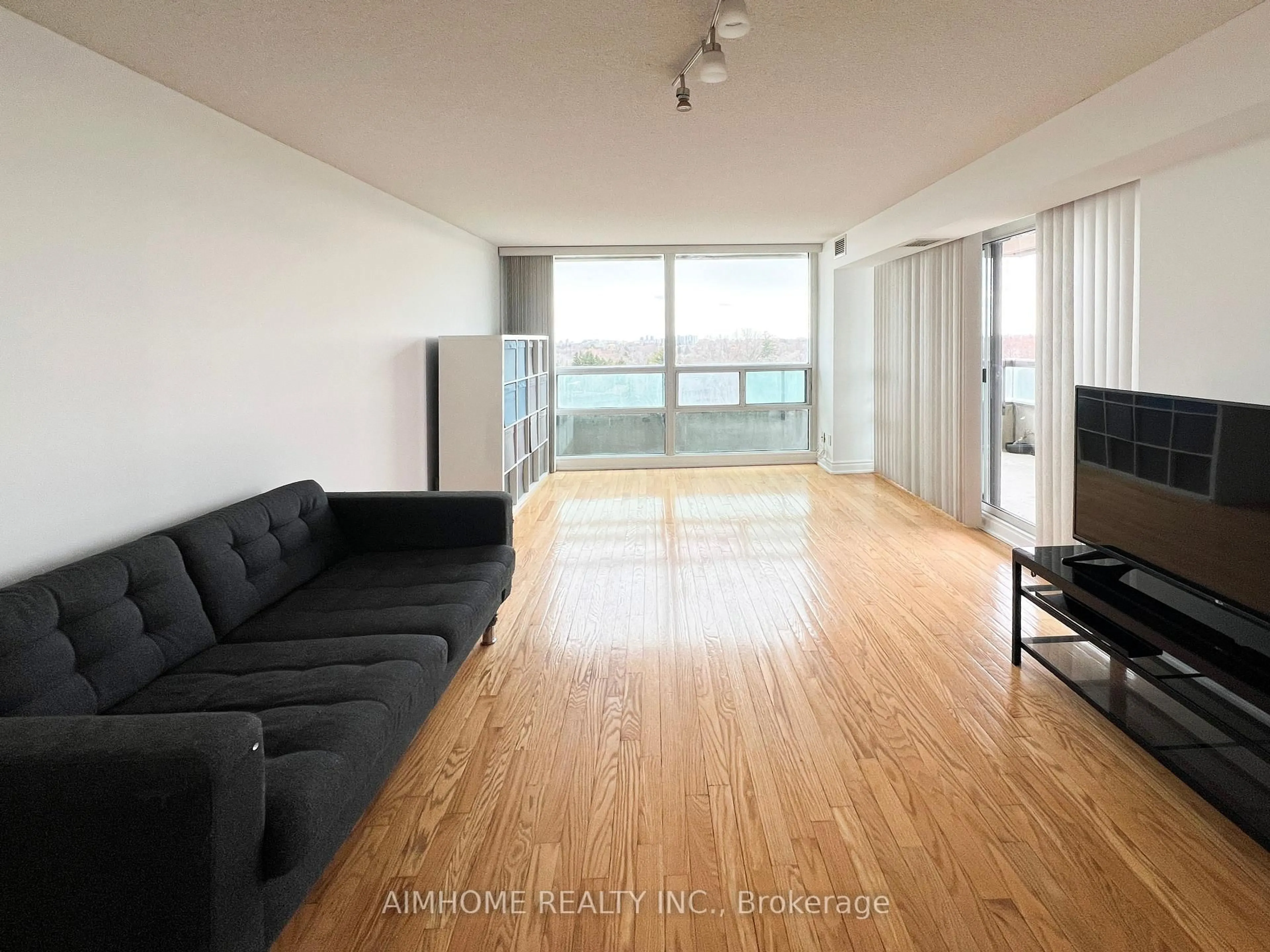 Living room with furniture, wood/laminate floor for 509 Beecroft Rd #809, Toronto Ontario M2N 0A3