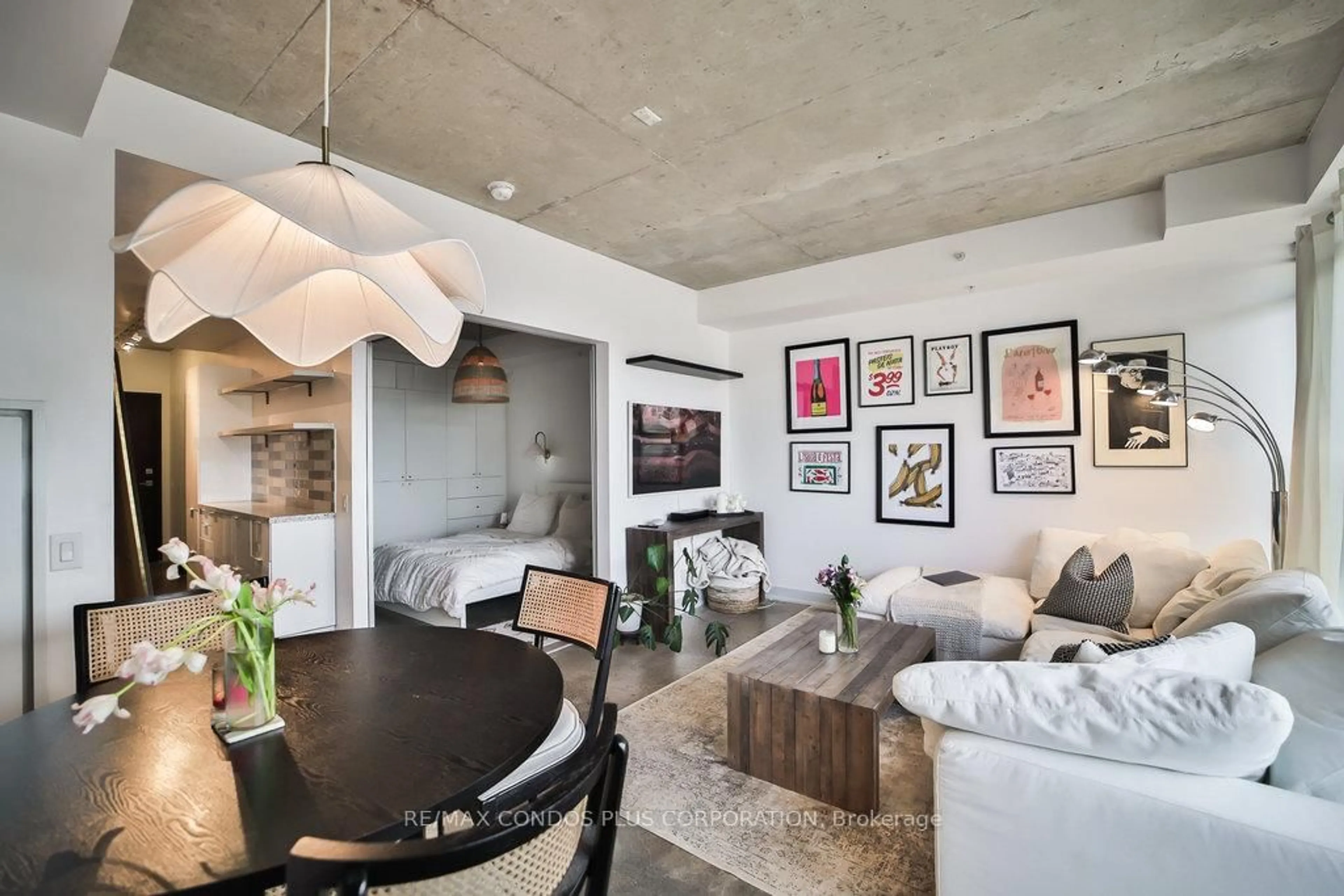 Living room with furniture, cement floor for 1239 Dundas St #206, Toronto Ontario M6J 0E8