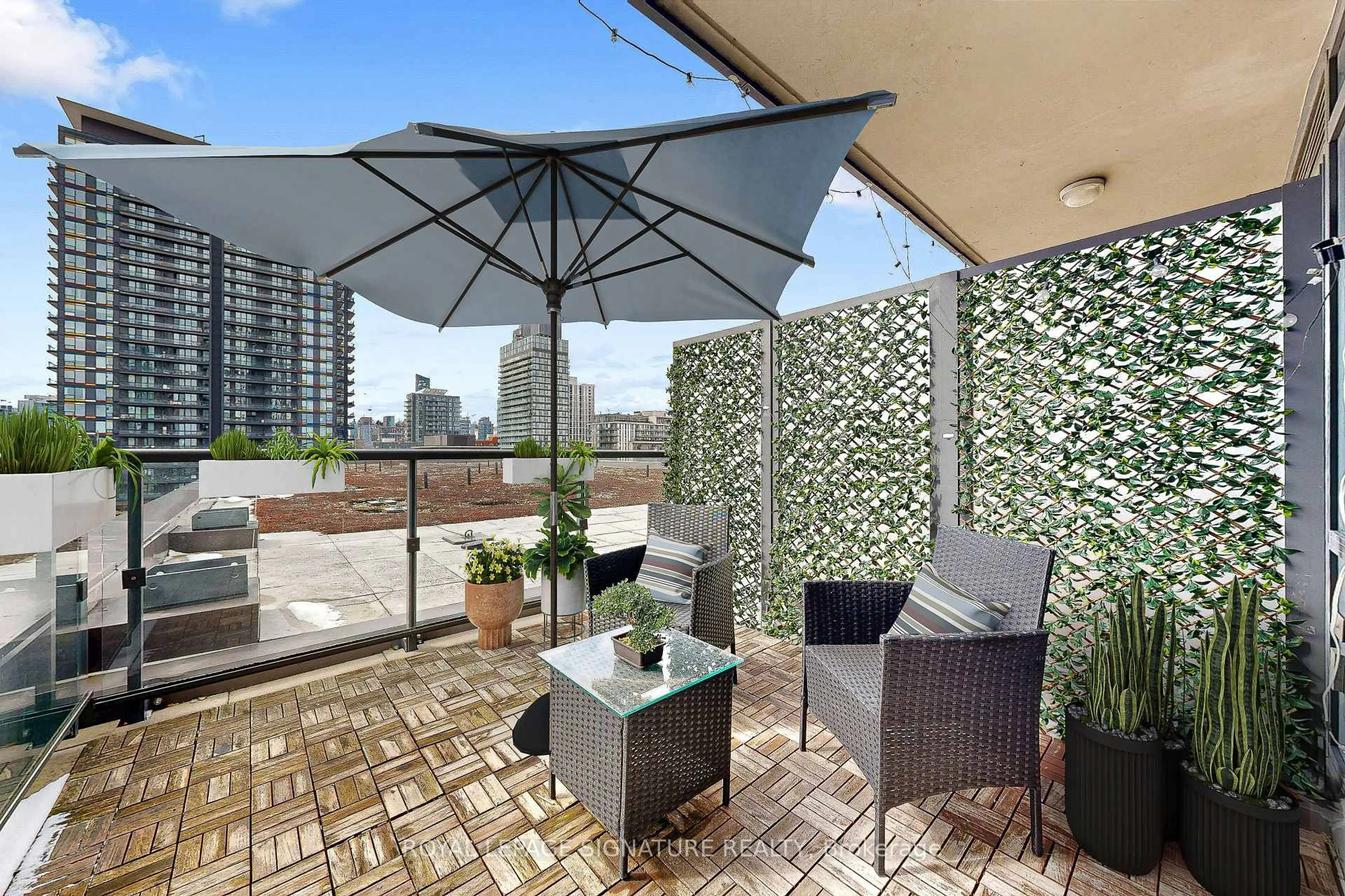 Patio, city buildings view from balcony for 170 Sumach St #907, Toronto Ontario M5A 0C3