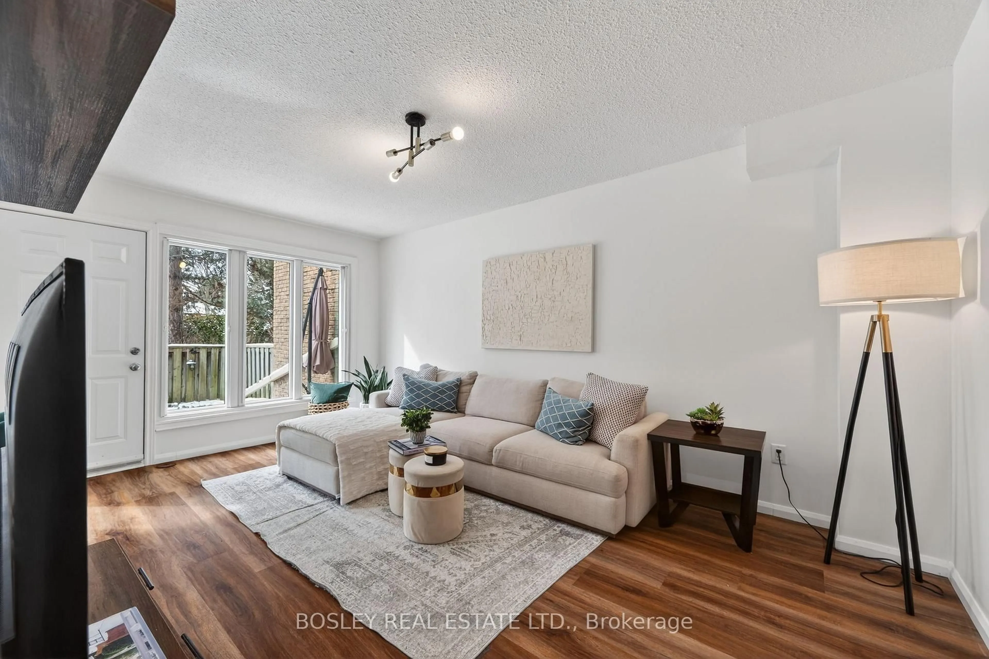 Living room with furniture, wood/laminate floor for 46 Rock Fern Way, Toronto Ontario M2J 4N4