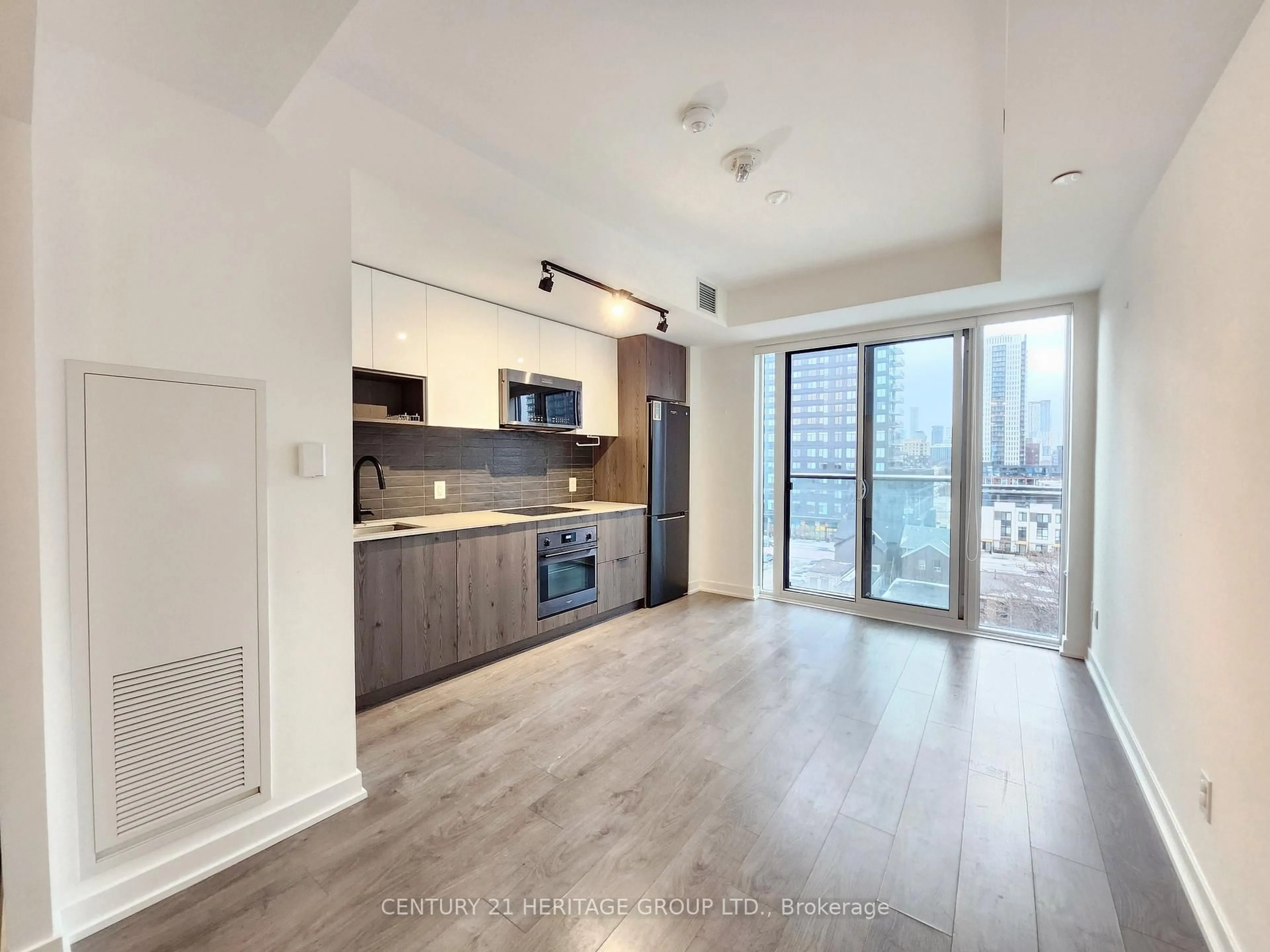 Open concept kitchen, wood/laminate floor for 5 Defries St #619, Toronto Ontario M5A 0W7