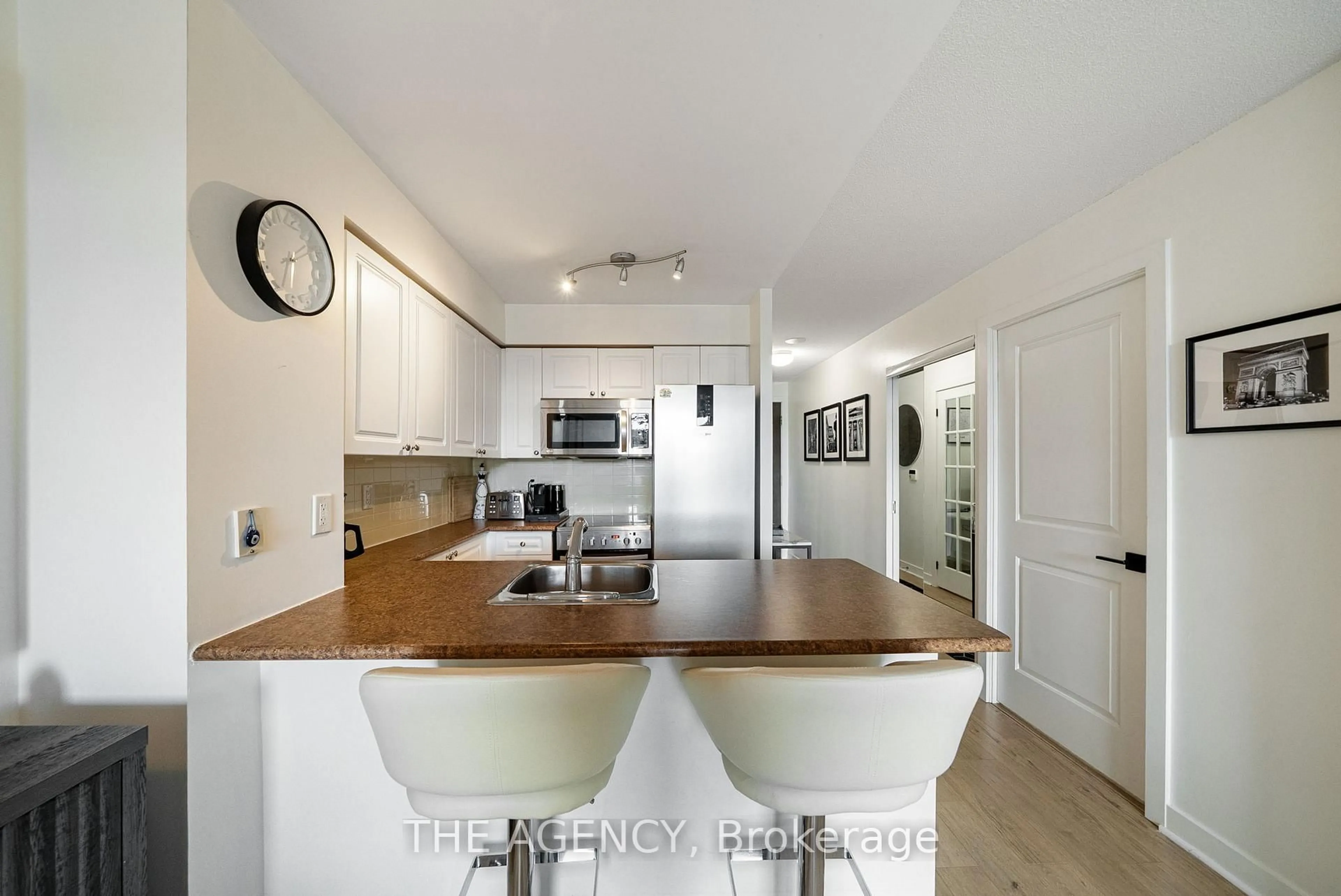 Open concept kitchen, wood/laminate floor for 50 Lynn Williams St #504, Toronto Ontario M6K 3R9