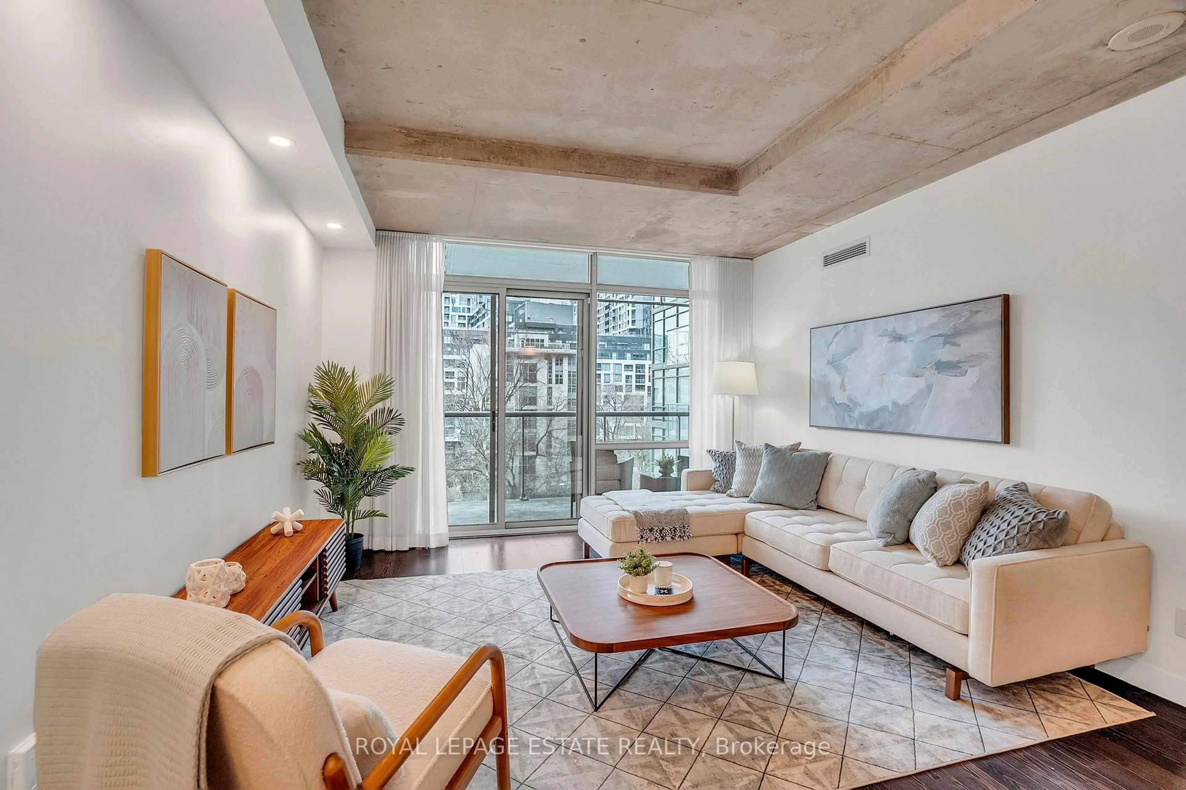 Living room with furniture, cement floor for 55 Stewart St #636, Toronto Ontario M5V 2V1