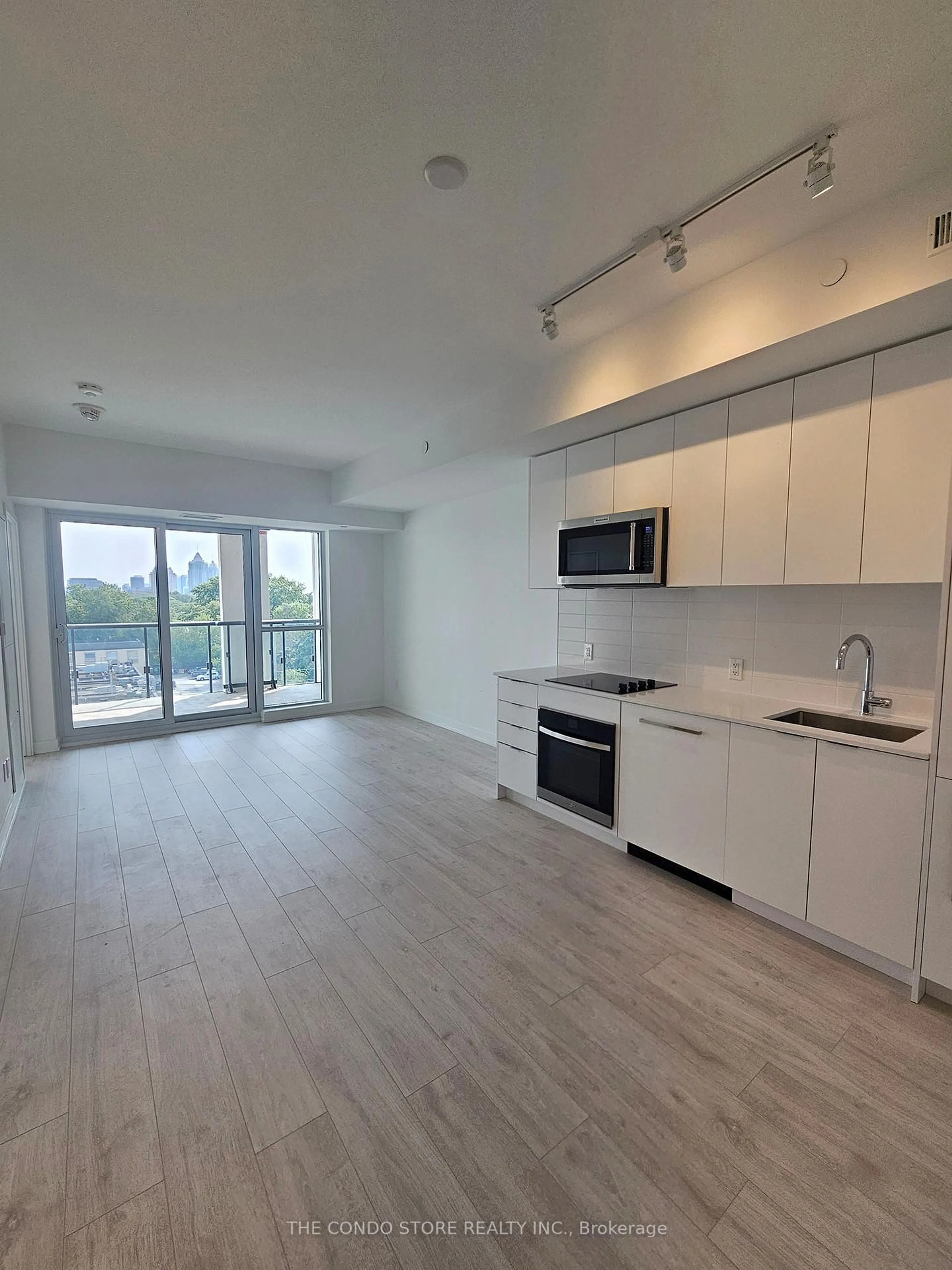 Open concept kitchen, wood/laminate floor for 181 Sheppard Ave #506, Toronto Ontario M2N 0L9