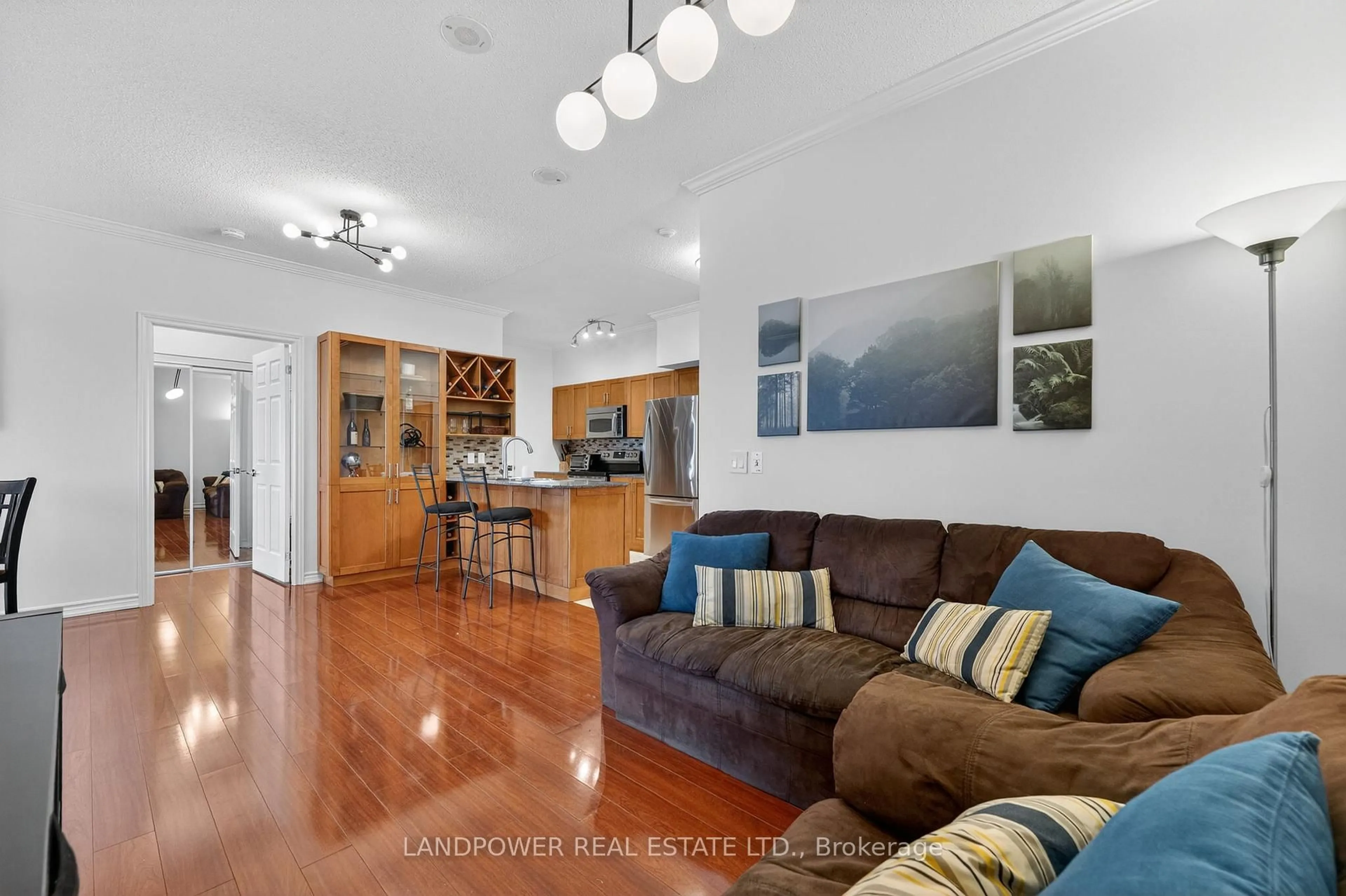 Living room with furniture, wood/laminate floor for 1730 Eglinton Ave E Ave #PH9, Toronto Ontario M4A 2X9