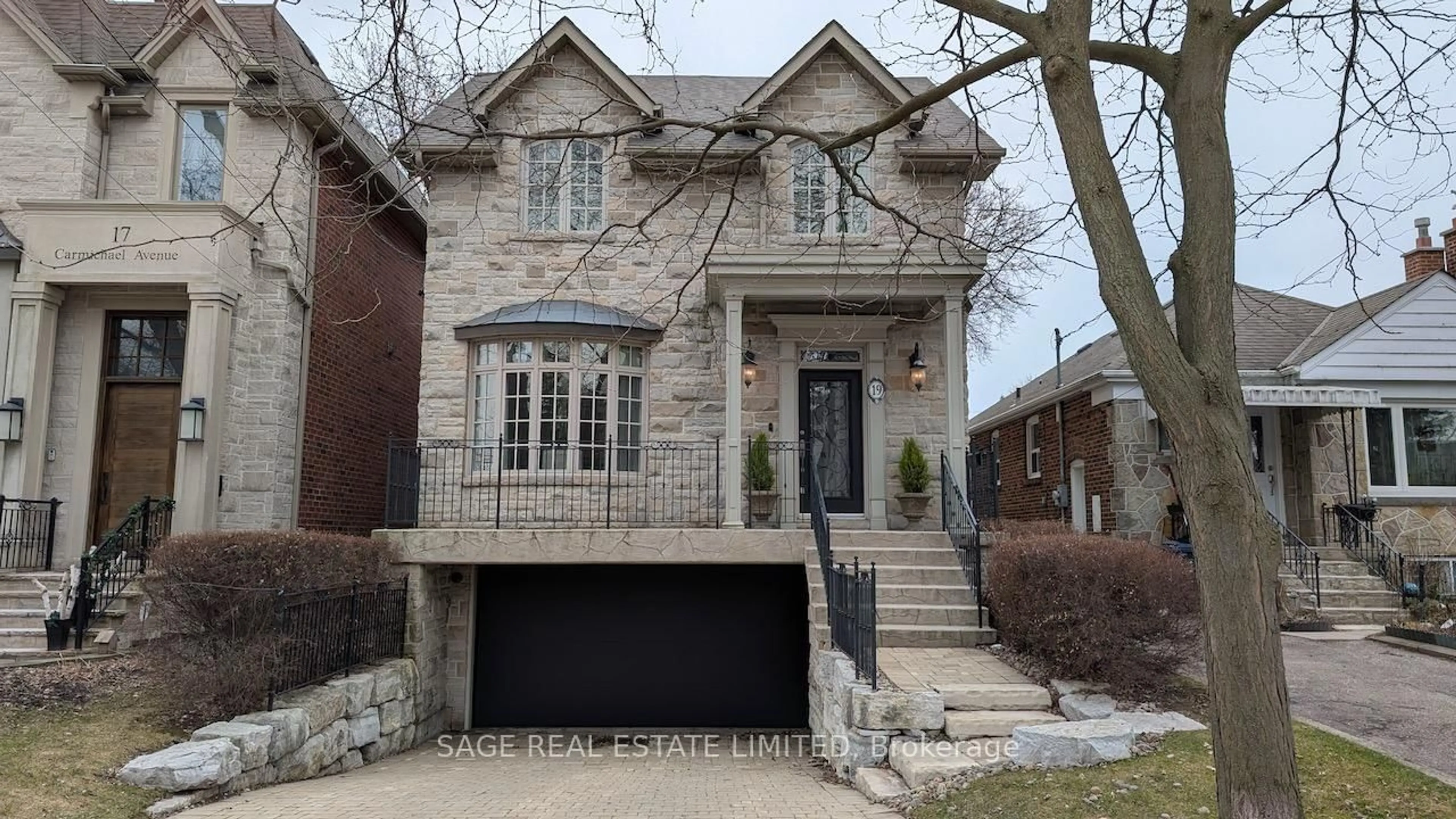 Home with brick exterior material, street for 19 Carmichael Ave, Toronto Ontario M5M 2W5
