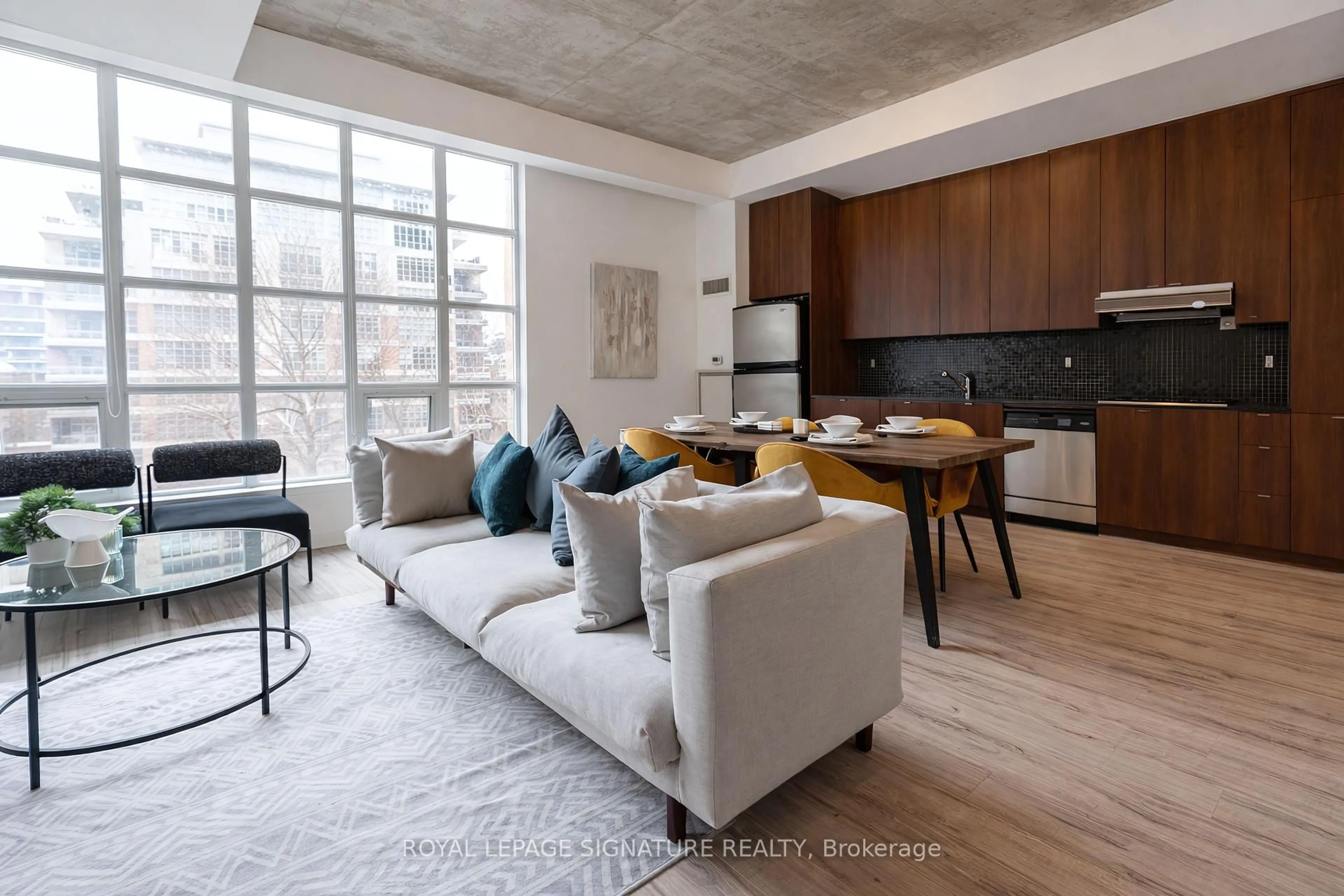 Living room with furniture, cement floor for 23 Brant St #305, Toronto Ontario M5V 2L5