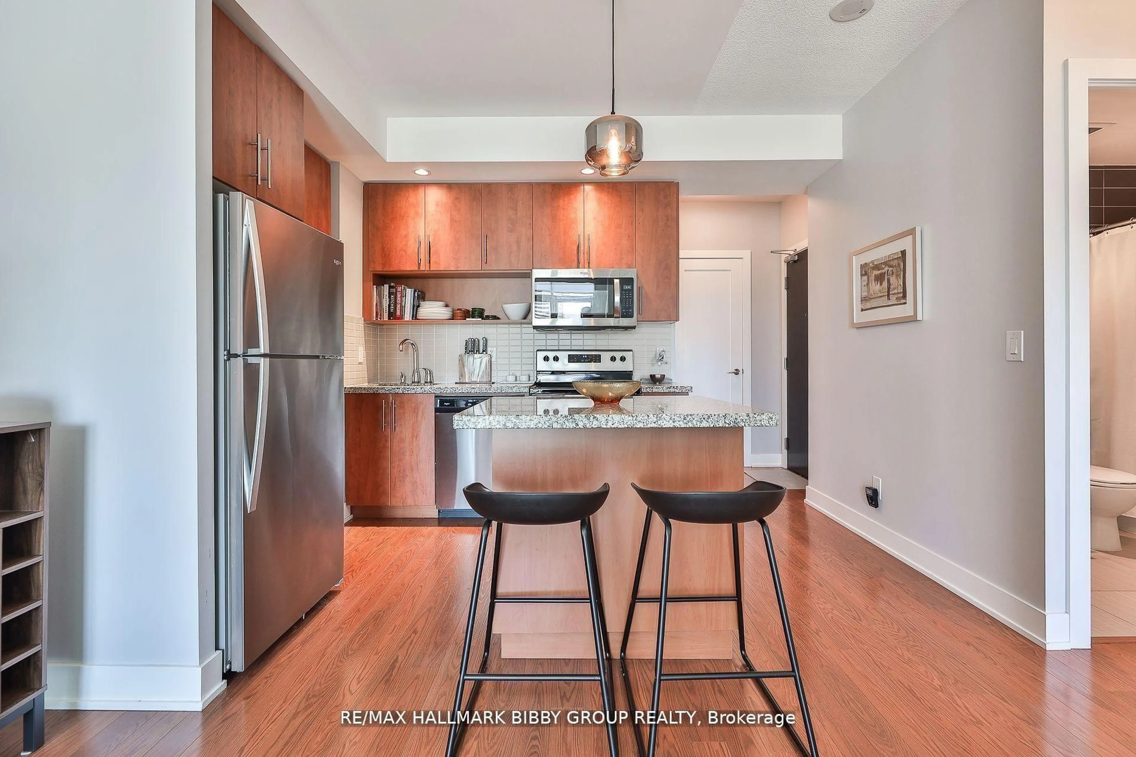 Open concept kitchen, wood/laminate floor for 120 Homewood Ave #1102, Toronto Ontario M4Y 1J4