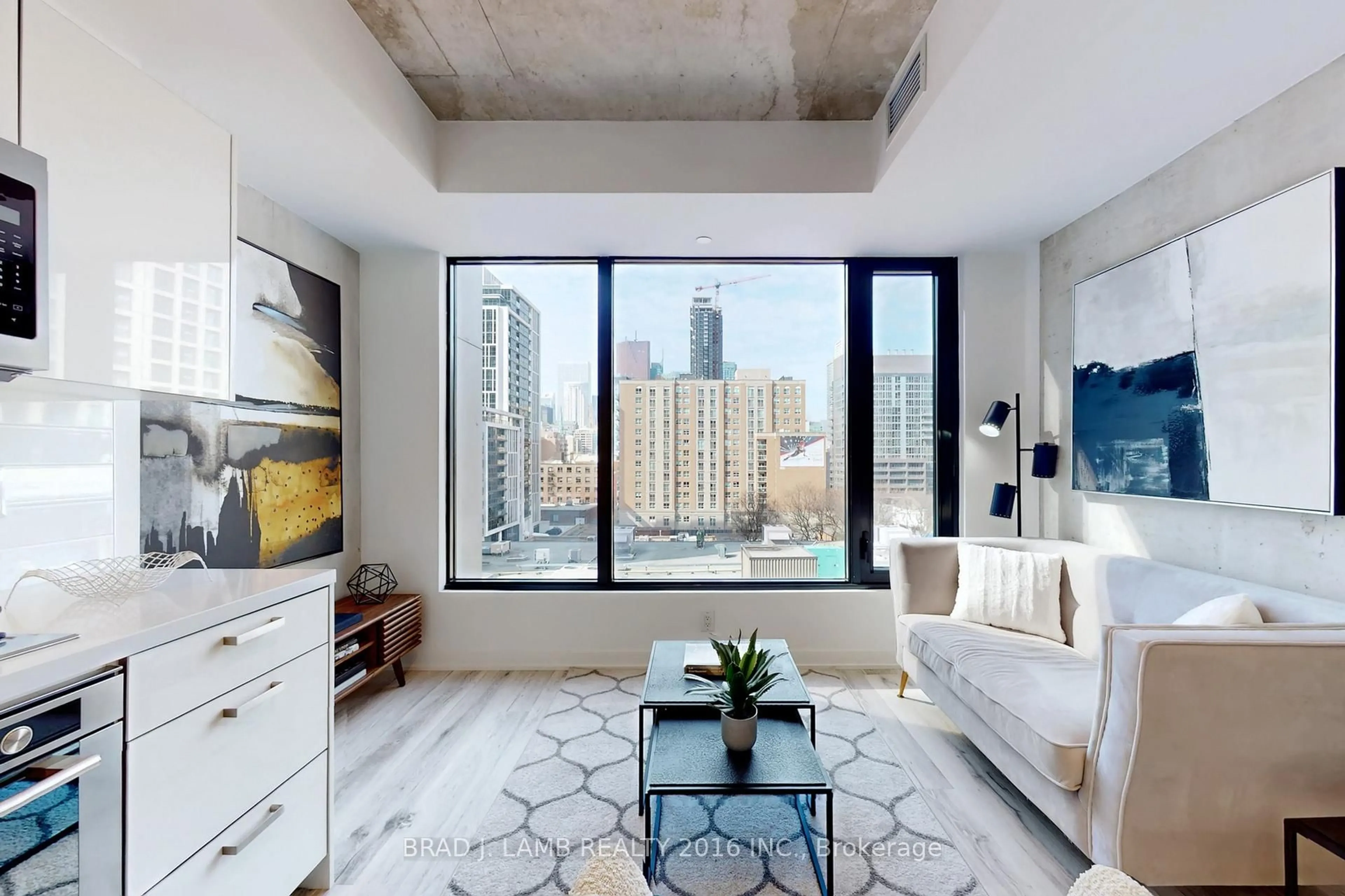 Living room with furniture, cement floor for 55 Ontario St #718, Toronto Ontario M5A 0T8