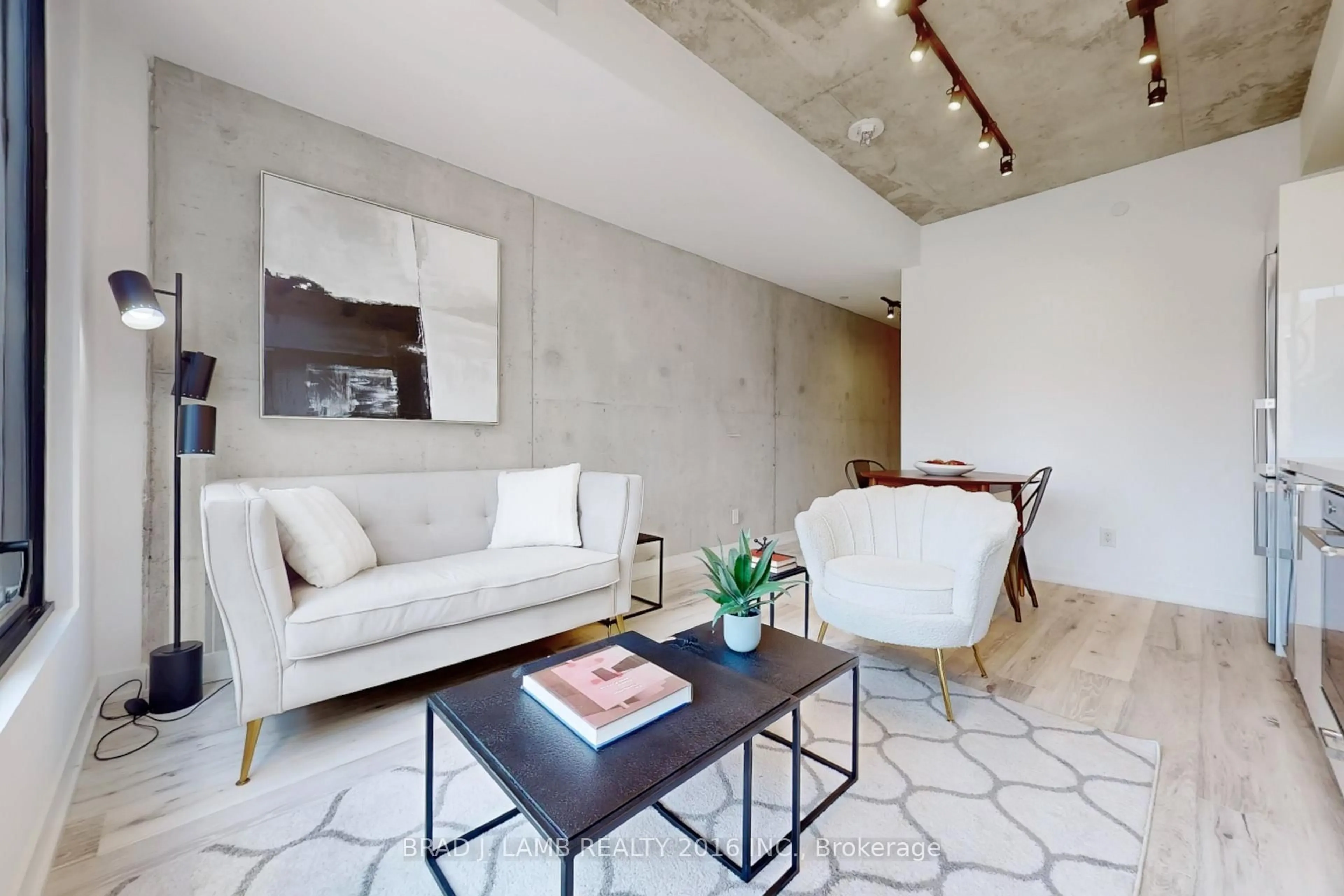 Living room with furniture, cement floor for 55 Ontario St #718, Toronto Ontario M5A 0T8