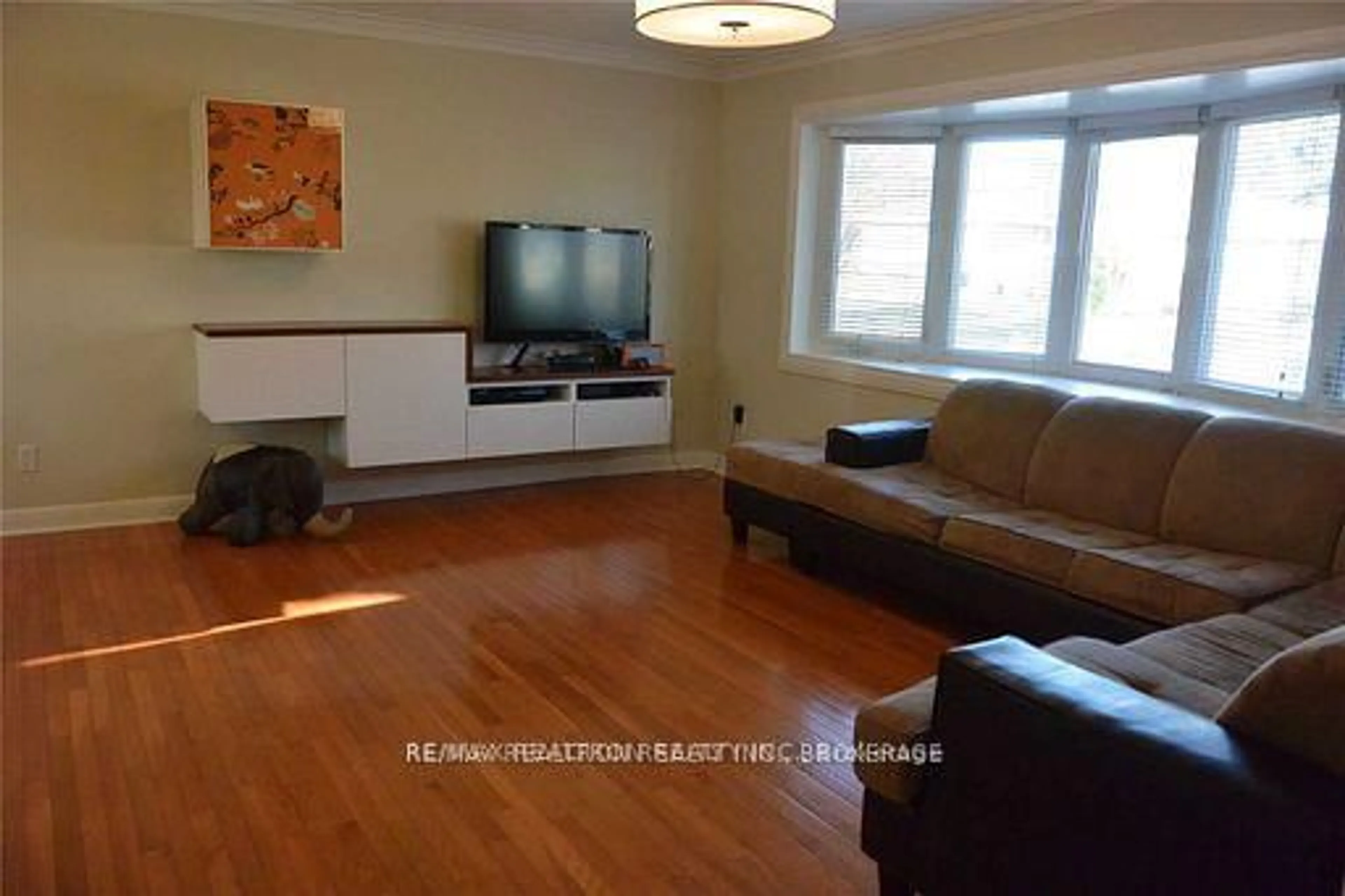 Living room with furniture, wood/laminate floor for 87 Combe Ave, Toronto Ontario M3H 4J6