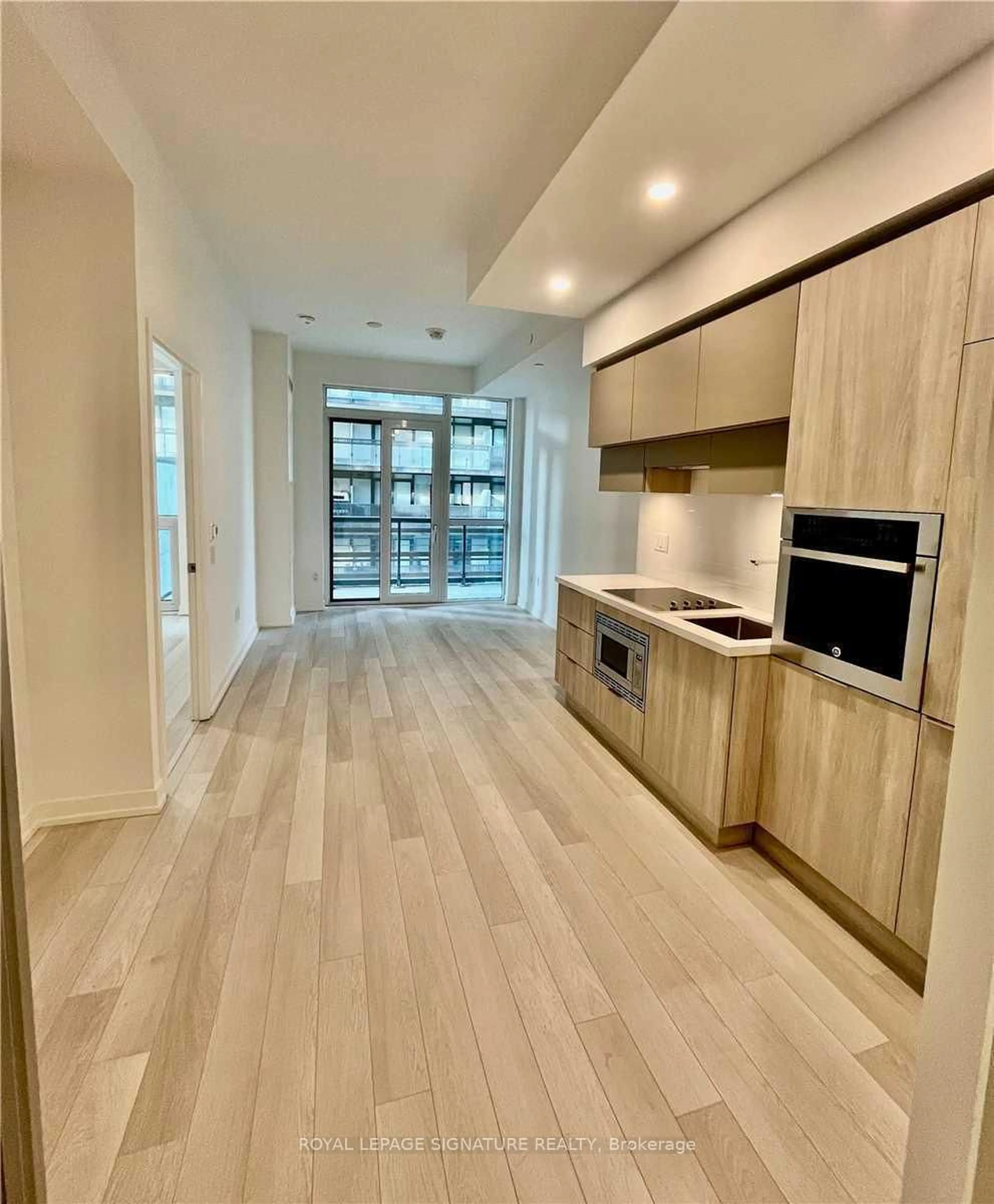 Open concept kitchen, wood/laminate floor for 39 Roehampton Ave #308, Toronto Ontario M4P 0G1