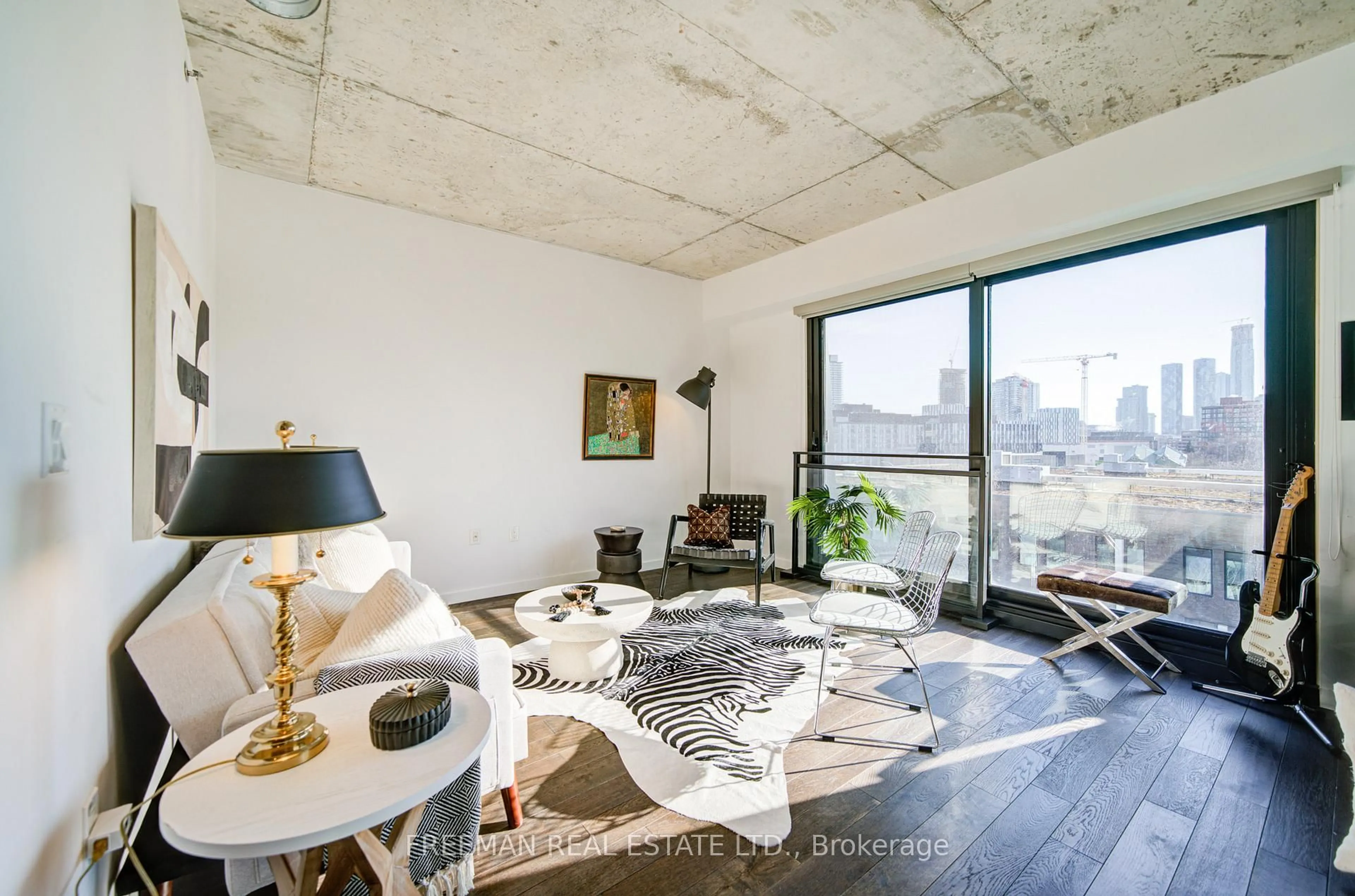 Living room with furniture, cement floor for 47 Lower River St #PH 37, Toronto Ontario M5A 0G1