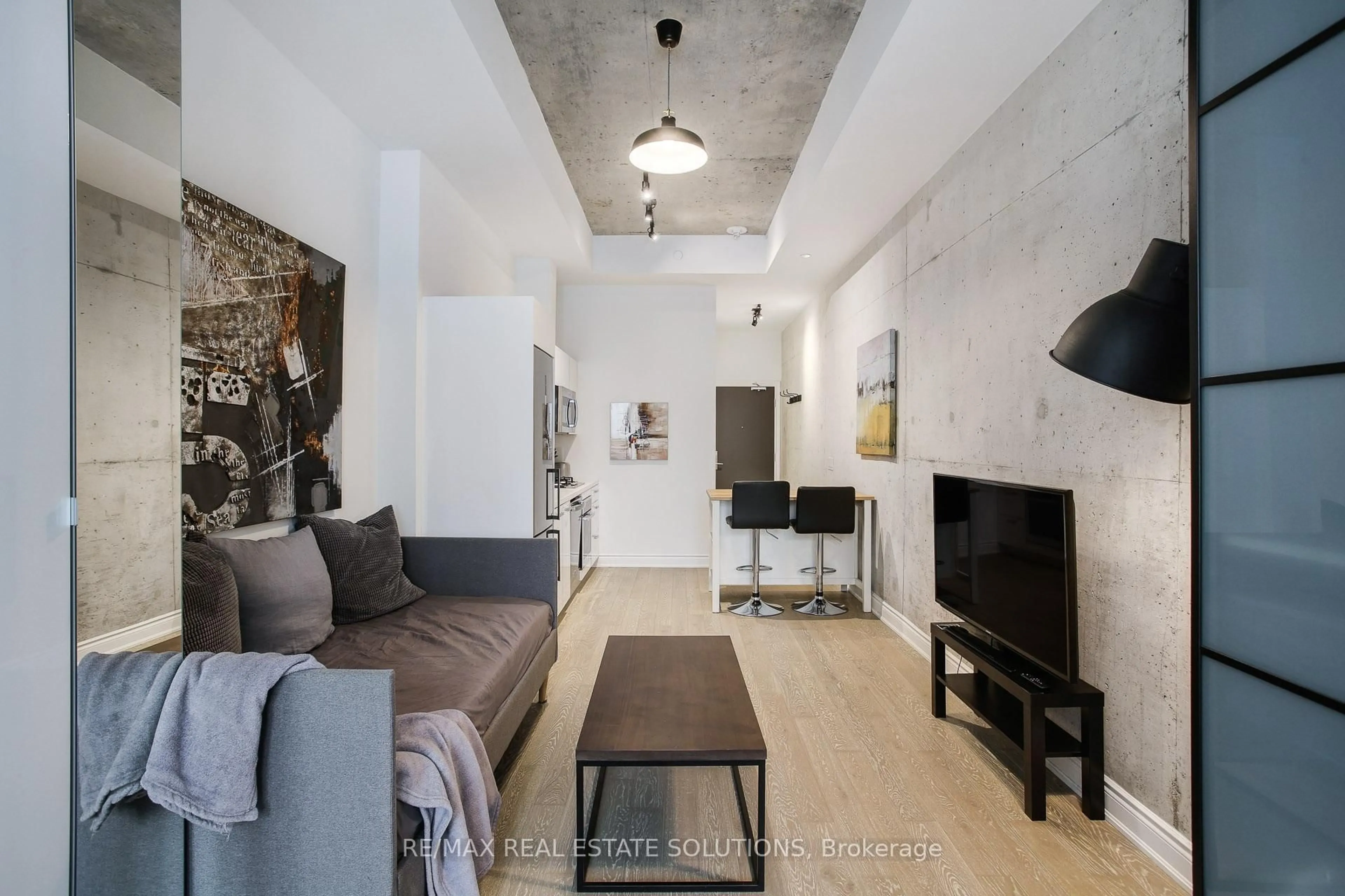 Living room with furniture, cement floor for 608 Richmond St #210, Toronto Ontario M5V 0N9